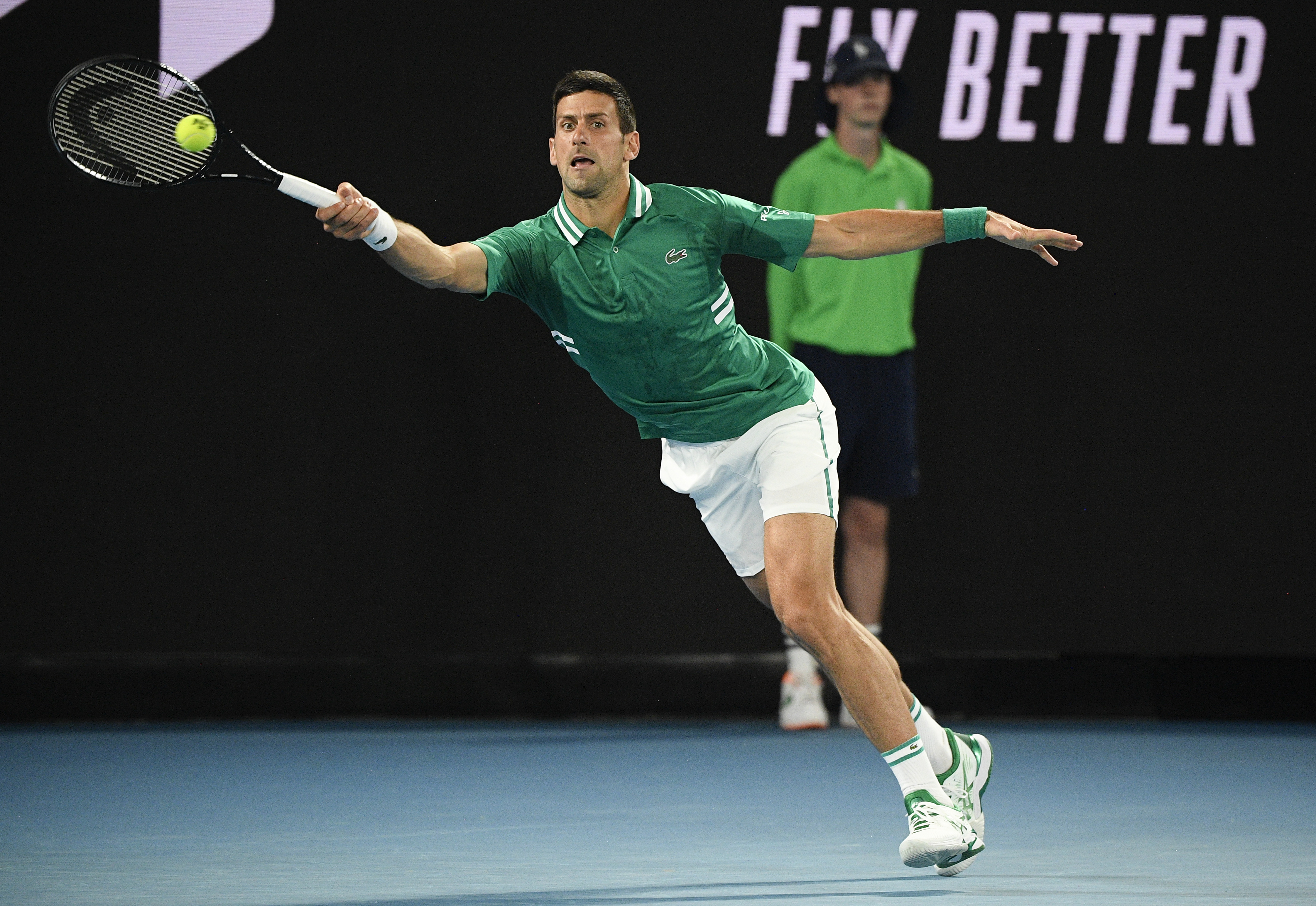 Serbia's Novak Djokovic hits a forehand return to Germany's Alexander Zverev during their quarterfinal match at the Australian Open tennis championship in Melbourne, Australia, Tuesday, Feb. 16, 2021.(AP Photo/Andy Brownbill)