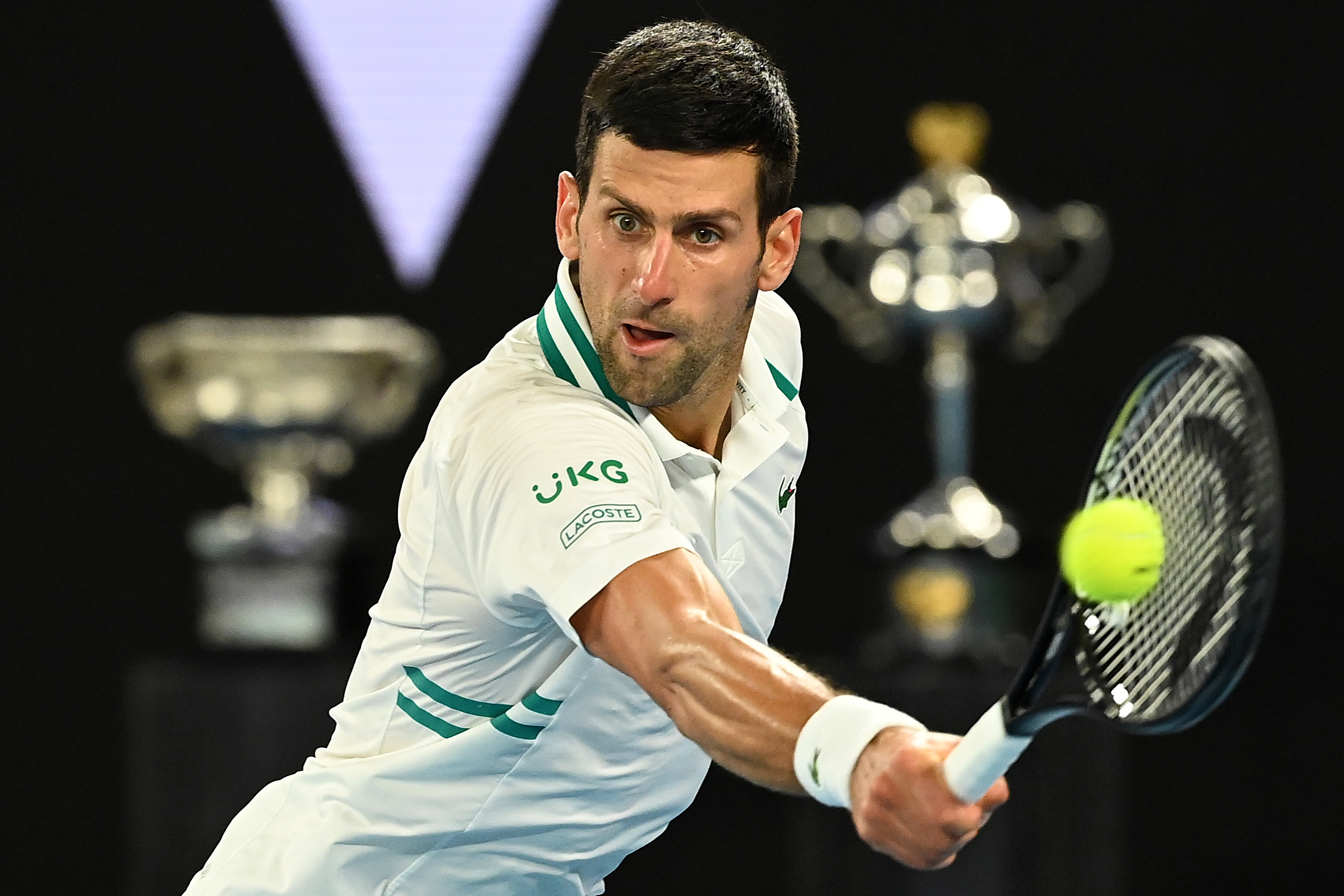 epa09020747 Novak Djokovic of Serbia in action during his Men's singles semifinals match against Aslan Karatsev of Russia on Day 11 of the Australian Open at Melbourne Park in Melbourne, 18 February 2021.  EPA-EFE/DAVE HUNT AUSTRALIA AND NEW ZEALAND OUT