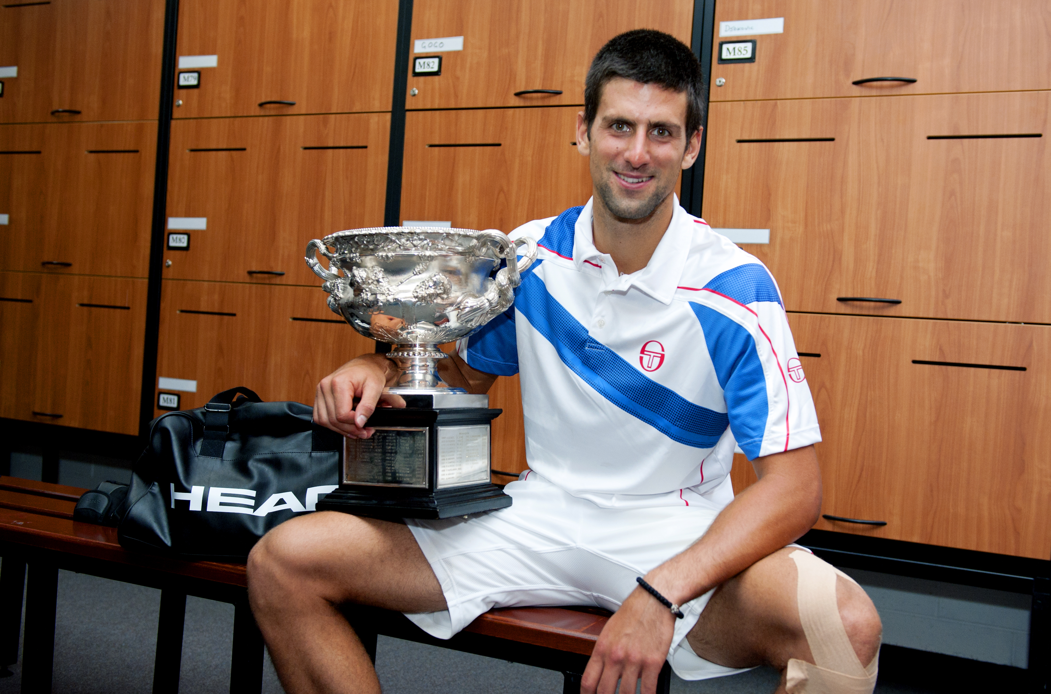 epa02556975 Novak Djokovic of Serbia celebrates after winning the men's singles championship on centre court at Rod Laver Arena against Andy Murray of Great Britain in Melbourne, Australia, 30 January 2011.  EPA/Ben Solomon / POOL