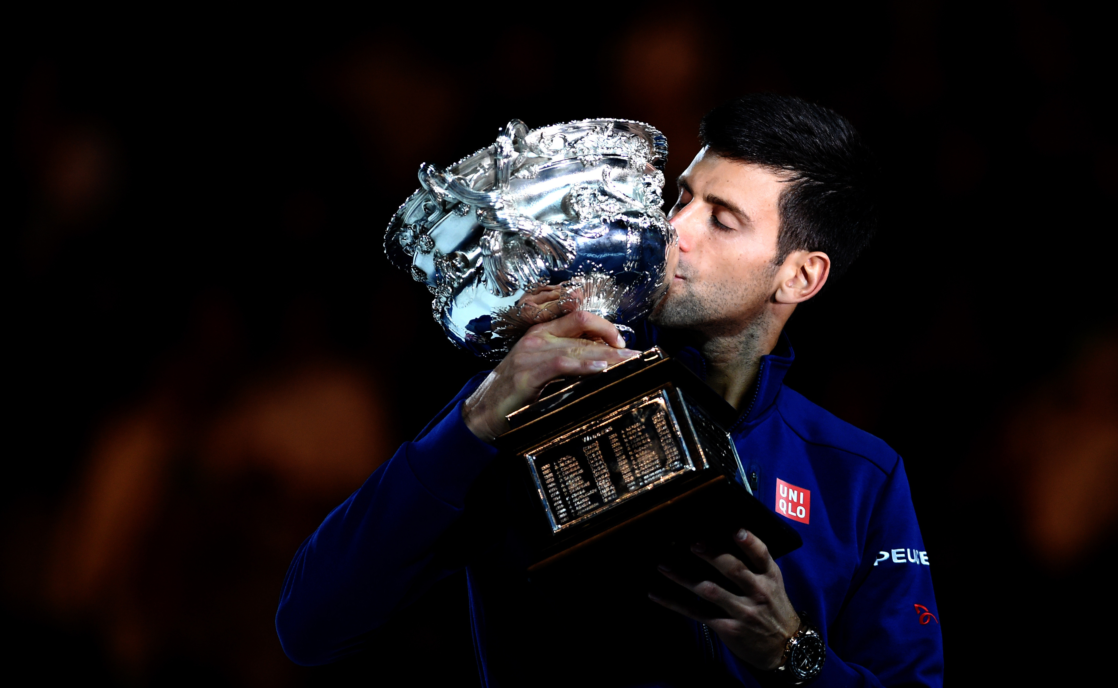 epa05137541 Novak Djokovic of Serbia celebrates his win against Andy Murray of the United Kingdom during the Men's final at the Australian Open tennis tournament in Melbourne, Australia, 31 January 2016.  EPA/LUKAS COCH AUSTRALIA AND NEW ZEALAND OUT