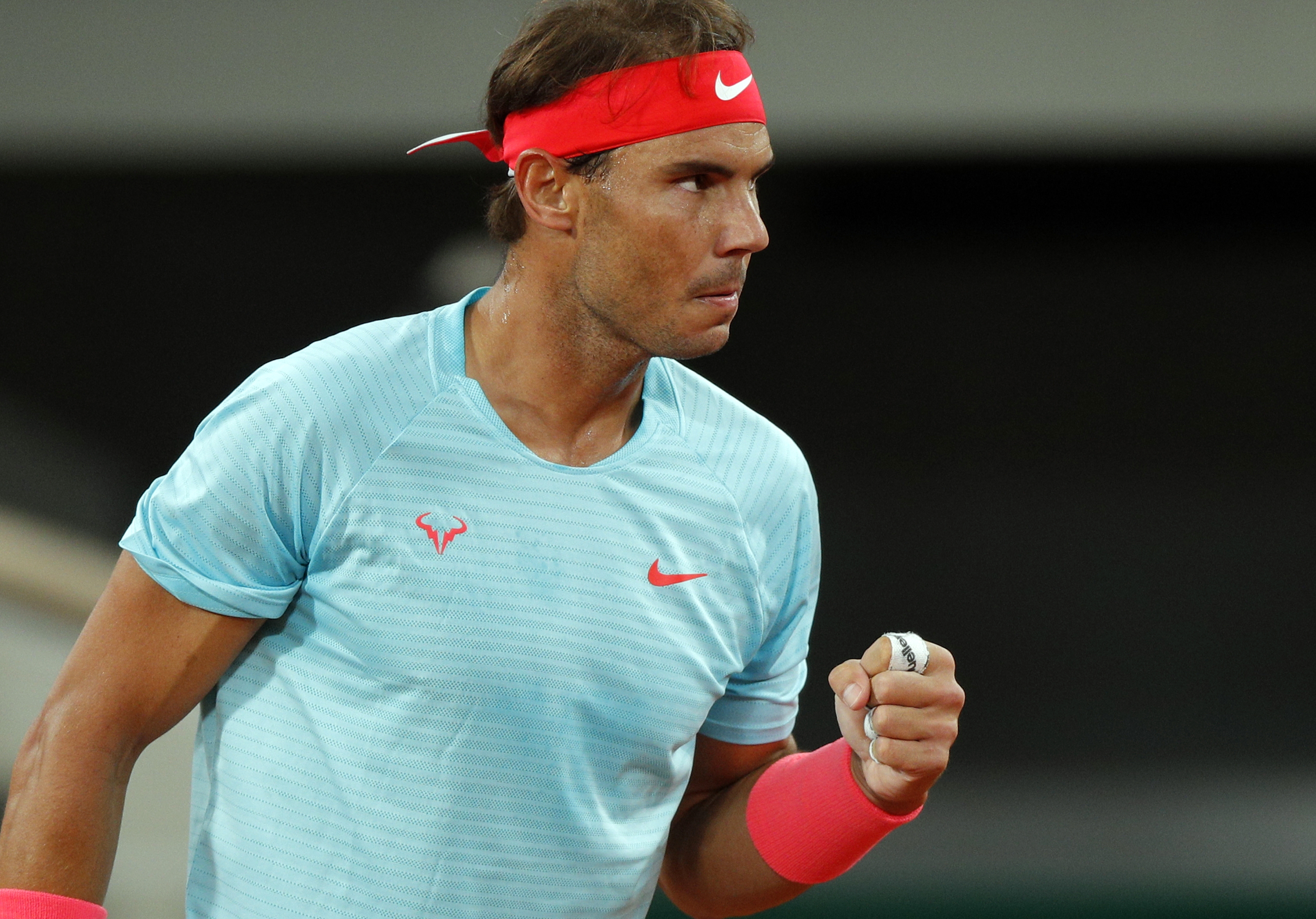 epa08735470 Rafael Nadal of Spain reacts as he plays Novak Djokovic of Serbia during their men?s final match during the French Open tennis tournament at Roland ?Garros in Paris, France, 11 October 2020.  EPA-EFE/YOAN VALAT
