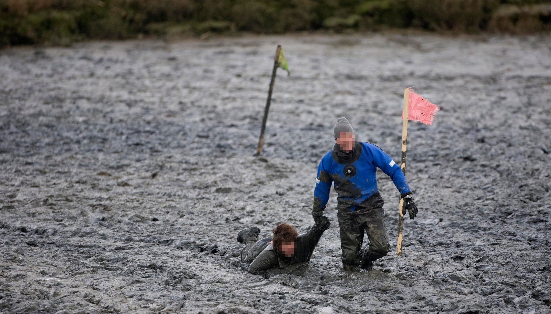 A Competitor is pulled out of the mud during the Maldon Mud Race. Picture by James Boardman