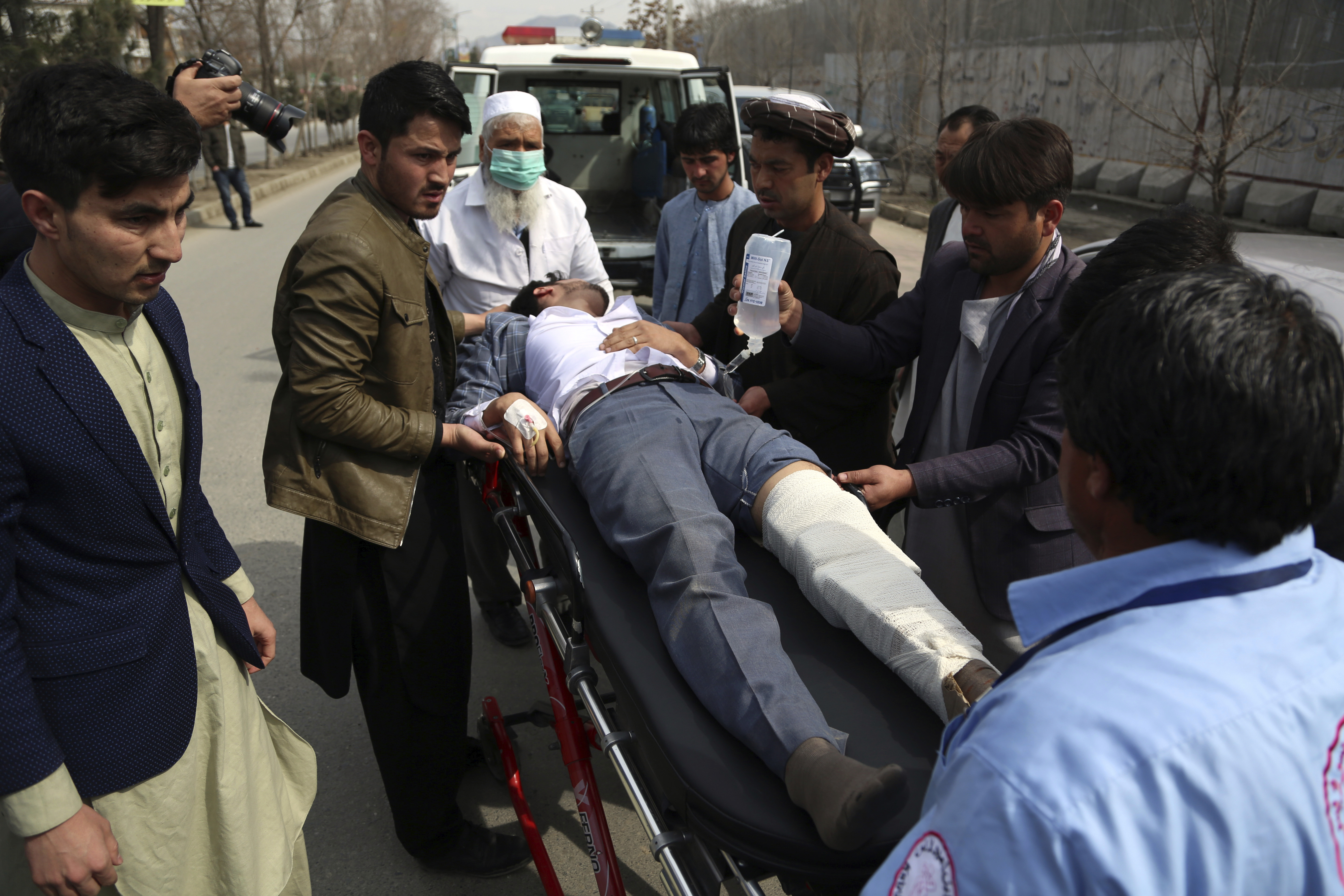 Kabul An injured man is carried into an ambulance after an attack in Kabul, Afghanistan, Friday, March 6, 2020. An Afghan official said gunmen in Afghanistan’s capital attacked a remembrance ceremony for a minority Shiite leader. (AP Photo/Rahmat Gul)