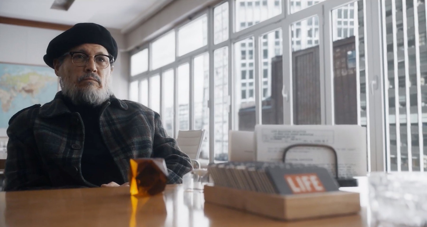 Depp goes under cover of grizzled beard for new role as a grizzled photo journalist