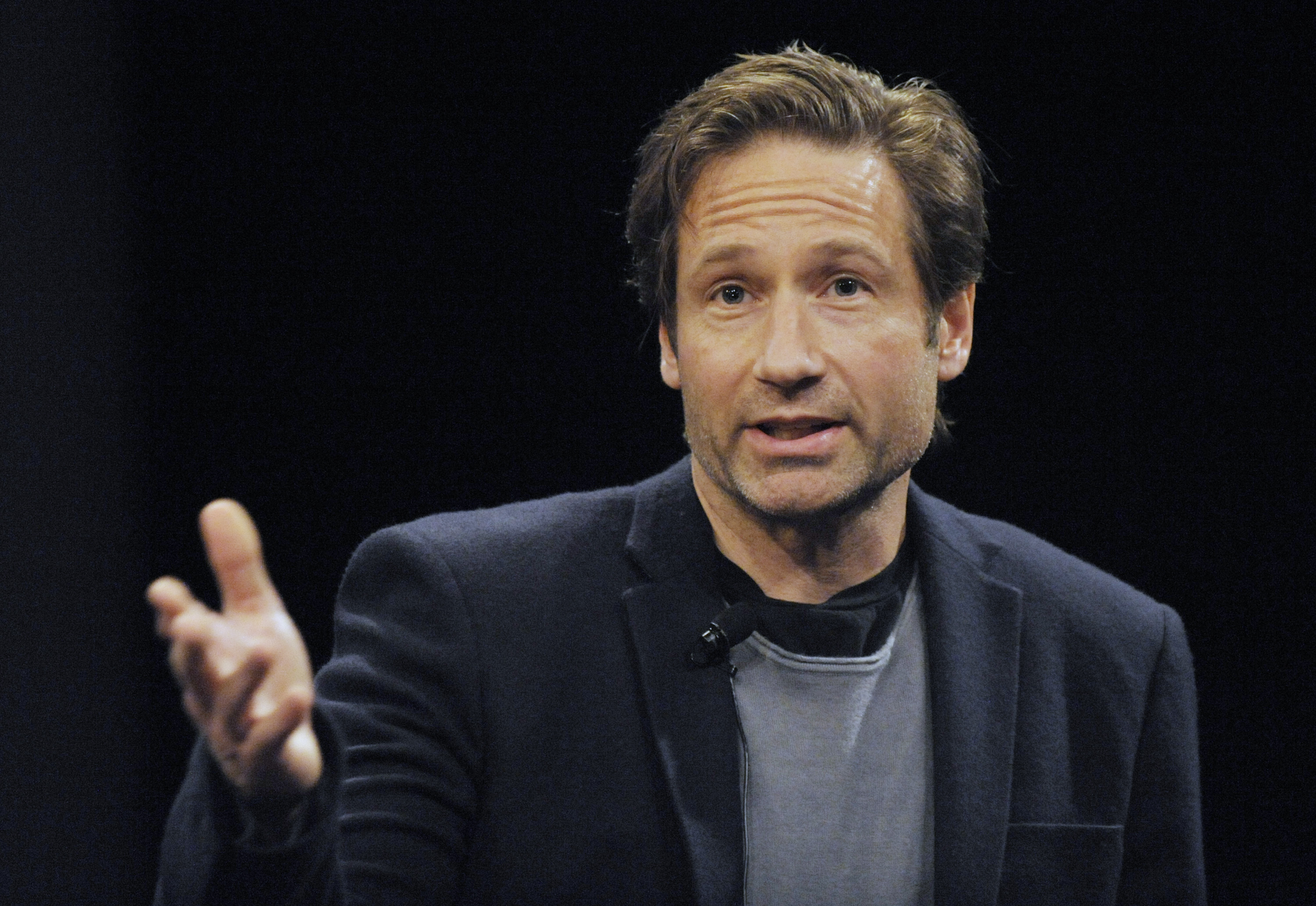 epa02700512 US Actor David Duchovny speaks at a discussion panel after a screening of 'The Revenge of the Electric Car' at the Tribeca Film Festival in New York, USA, 23 April, 2011. The Tribeca Film Festival runs through 01 May 2011.  EPA/PETER FOLEY
