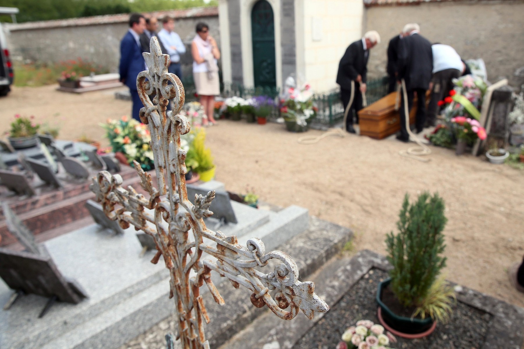People at a funeral in a cemetery. France.