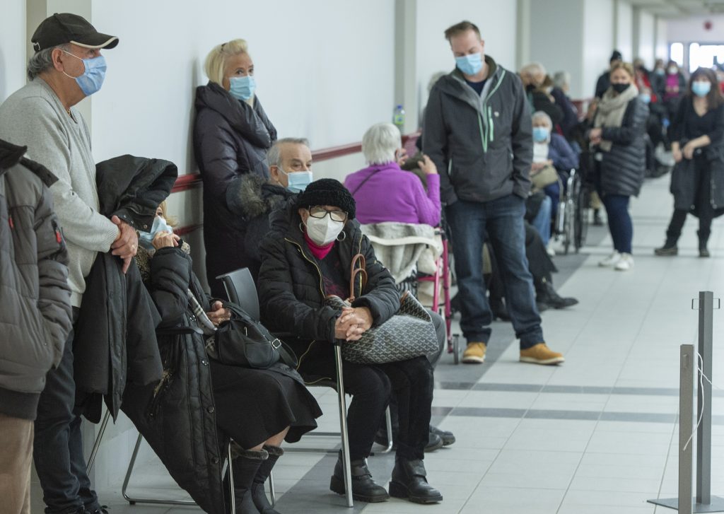 Seniors wait for their COVID-19 vaccinations as Quebec begins mass vaccinations based on age across the province Monday, March 1, 2021, in Montreal. (Ryan Remiorz/The Canadian Press via AP)