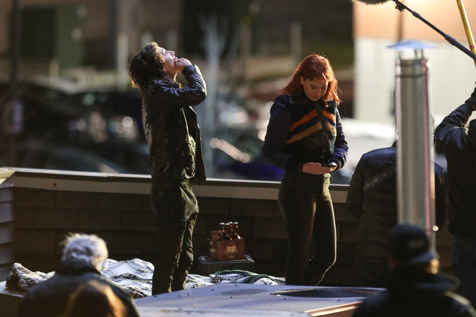 *EXCLUSIVE* Timothee Chalamet and Jennifer Lawrence get close on the roof of a fast food joint for "Don't Look Up"