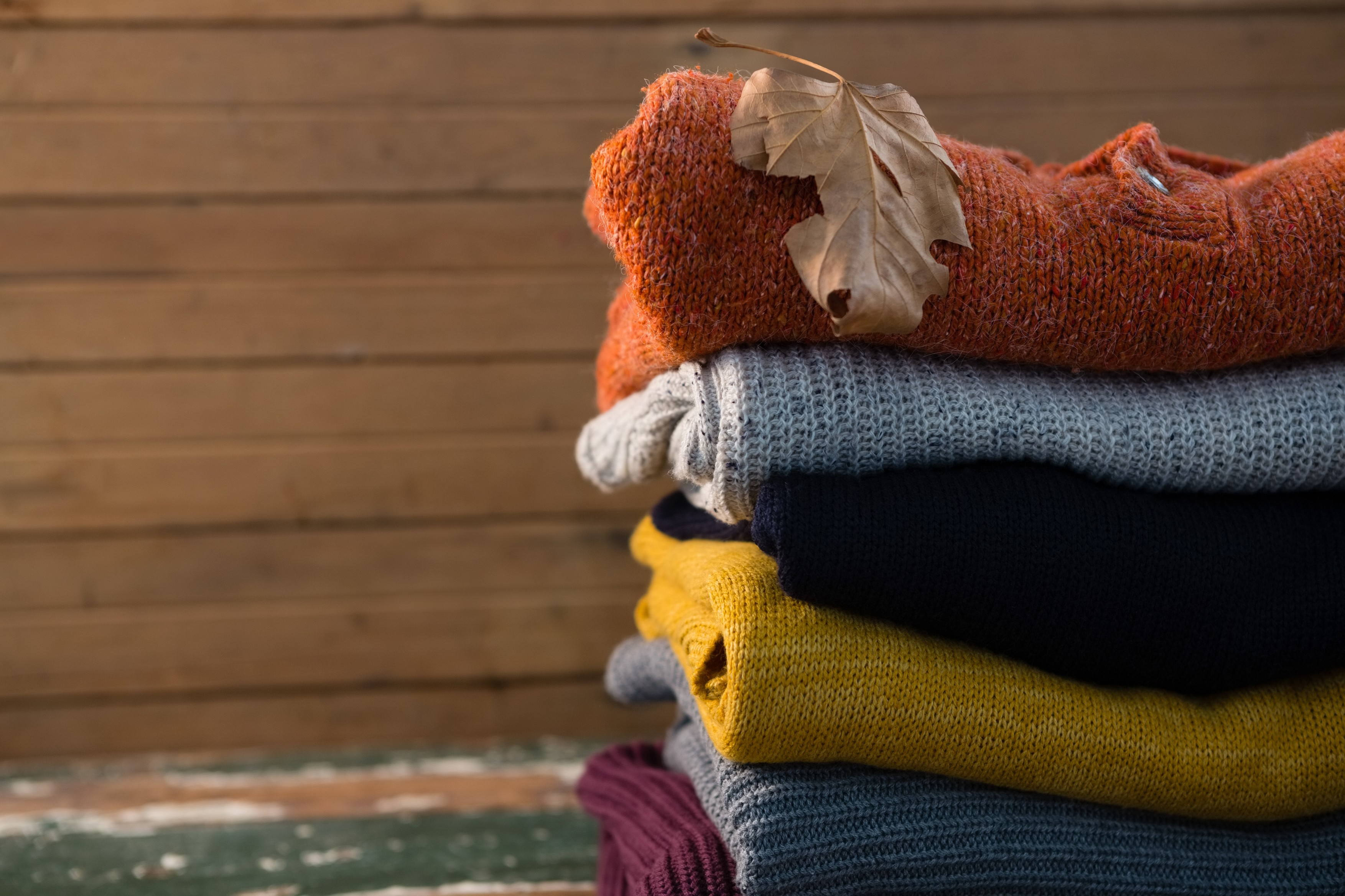 Stack of sweater on table