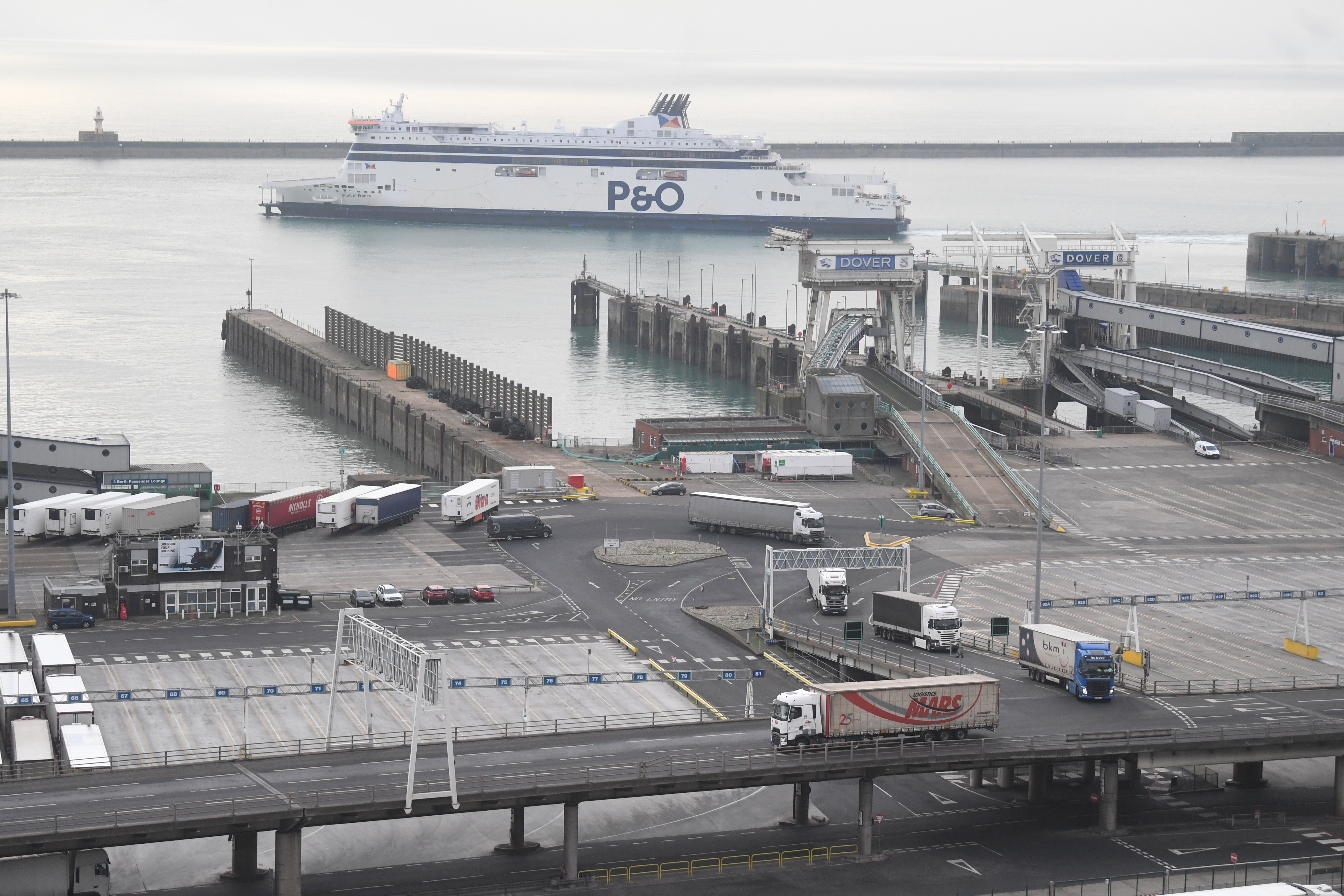 epa08914110 Lorries depart a ferry at the port of Dover in Britain 01 January 2021. Britain left the European Union at 11pm on 31 December 2020.  EPA-EFE/NEIL HALL