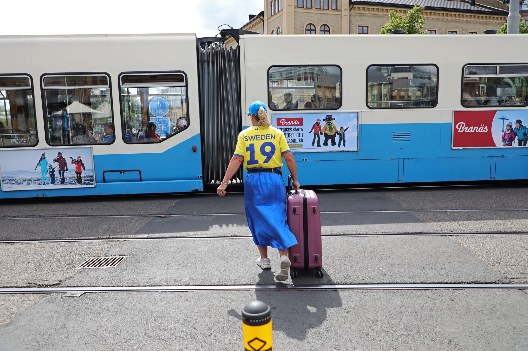 A woman wearing a Swedish national team jersey in central Gothenburg.