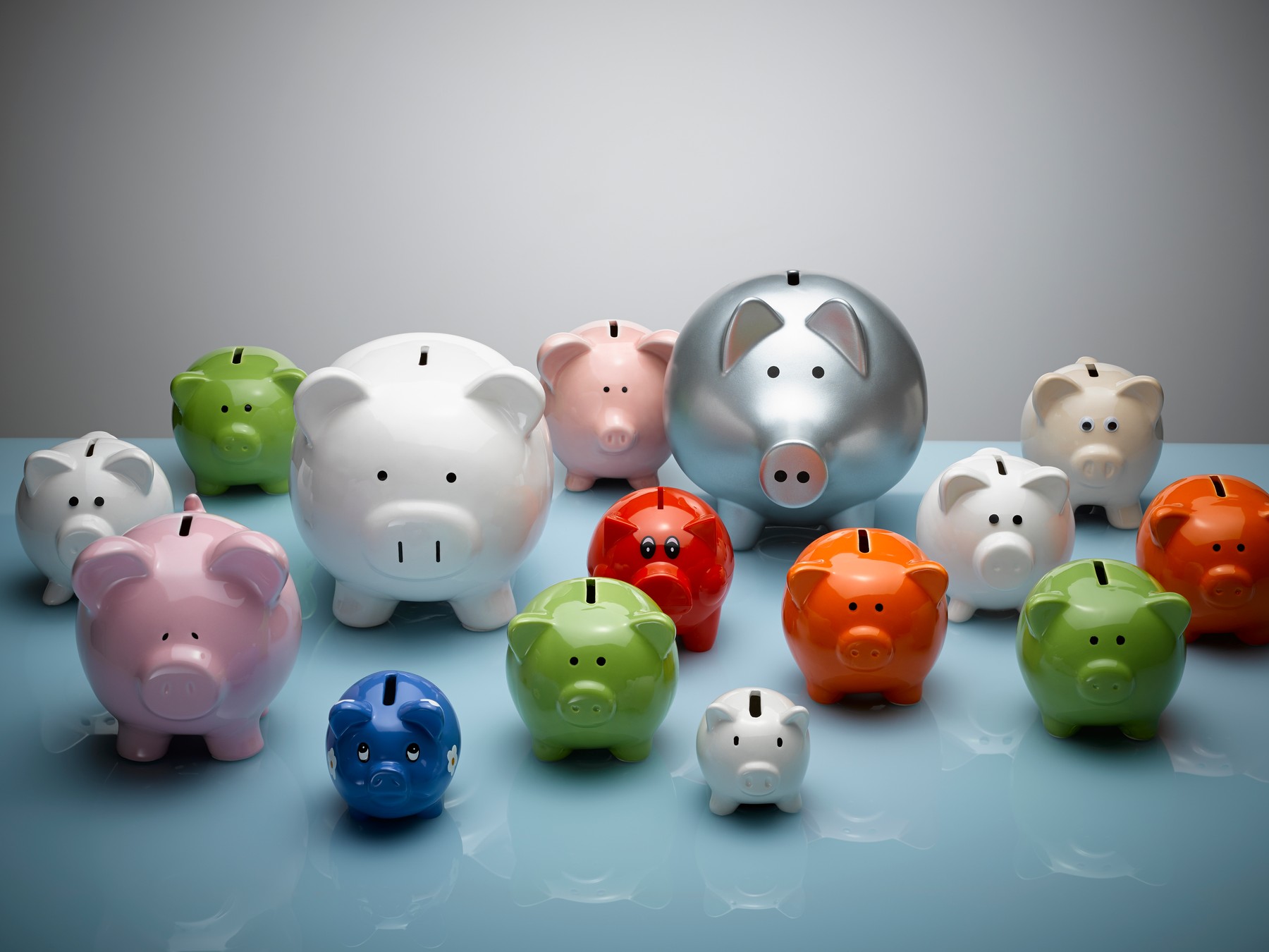 Multicolor piggy banks still life