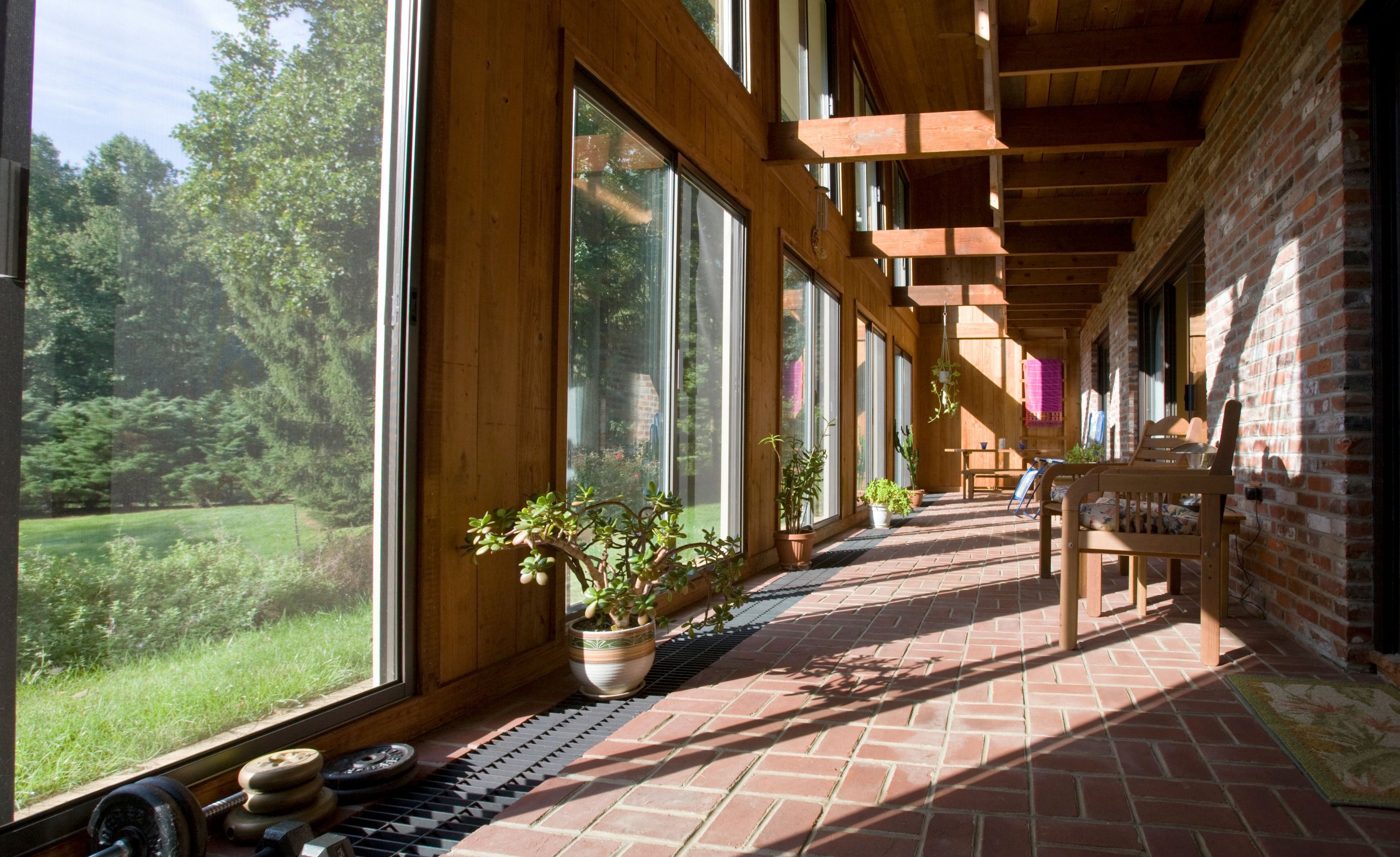 Interior view of the atrium (solarium) in a passive solar "envelope house" design home in residential neighborhood.