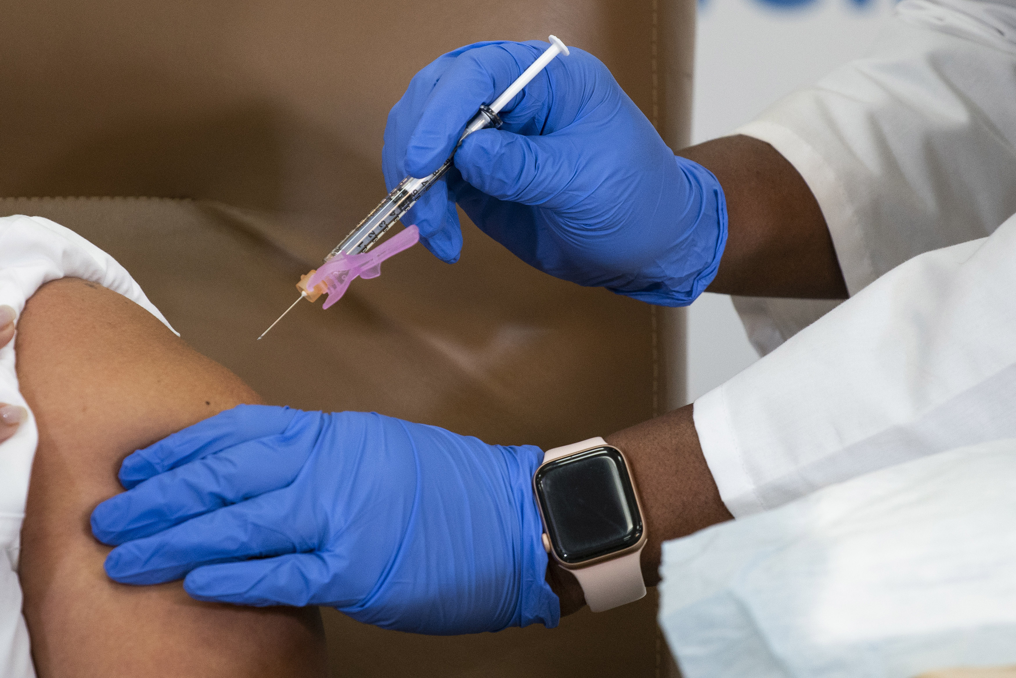Healthcare workers receive the Moderna COVID-19 vaccine