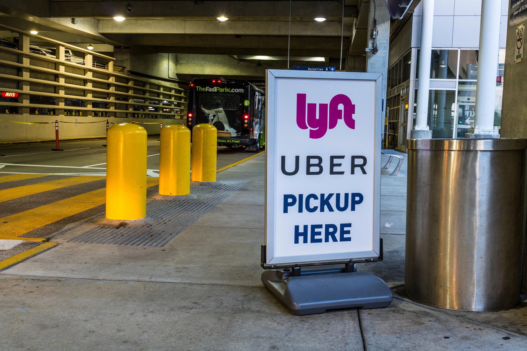 Indianapolis - Circa July 2017: Ride sharing companies Lyft and Uber pickup spot at the airport. Lyft and Uber have replaced many Taxi cabs for transp