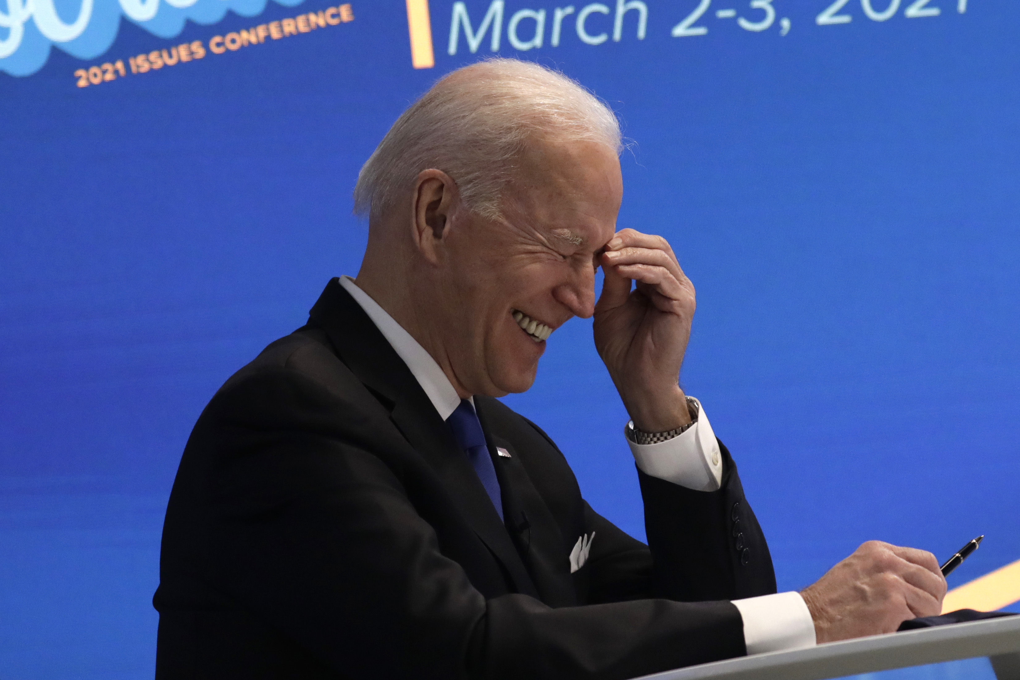 epa09050283 US President Joe Biden laughs during a virtual event with the House Democratic Caucus in the Eisenhower Executive Office Building at the White House in Washington, DC, USA, 03 March 2021.  EPA-EFE/Yuri Gripas / POOL