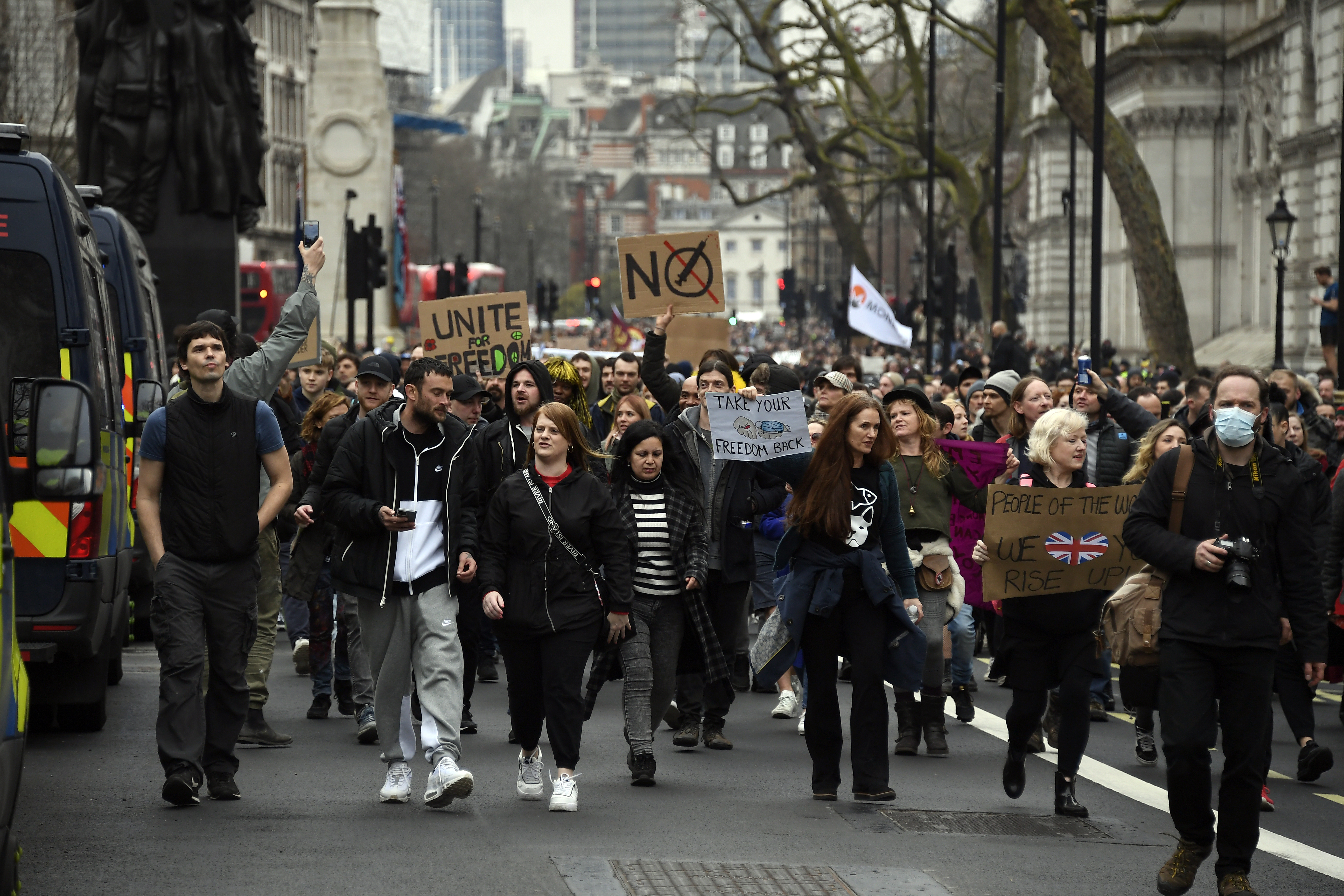 People without face masks attend a protest against government restrictions to curb the spread of the coronavirus, in London, Saturday, March 20, 2021. (AP Photo/Alberto Pezzali)