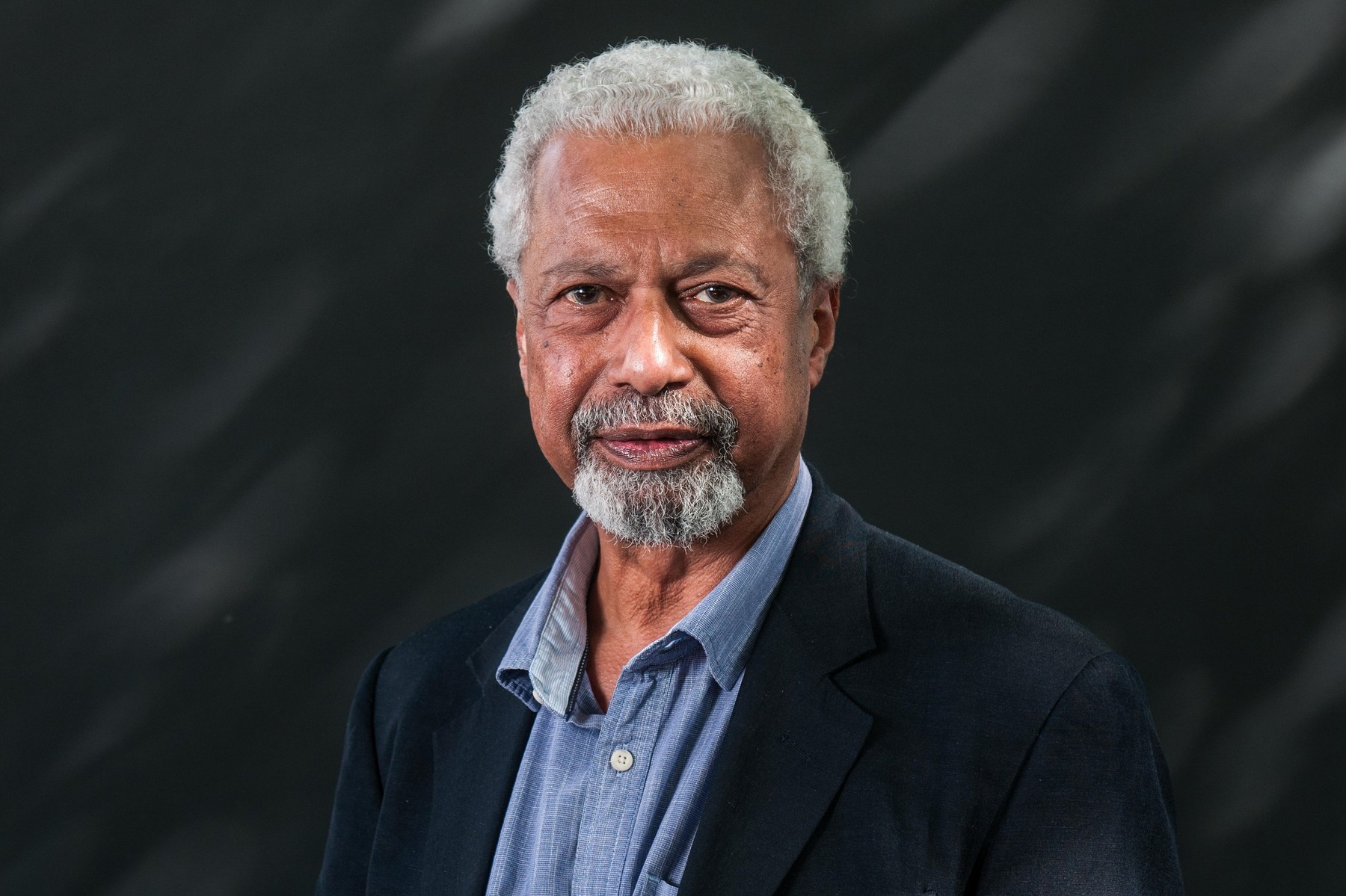 Tanzanian novelist Abdulrazak Gurnah attends a photocall during the Edinburgh International Book Festival on August 12, 2017 in Edinburgh, Scotland.