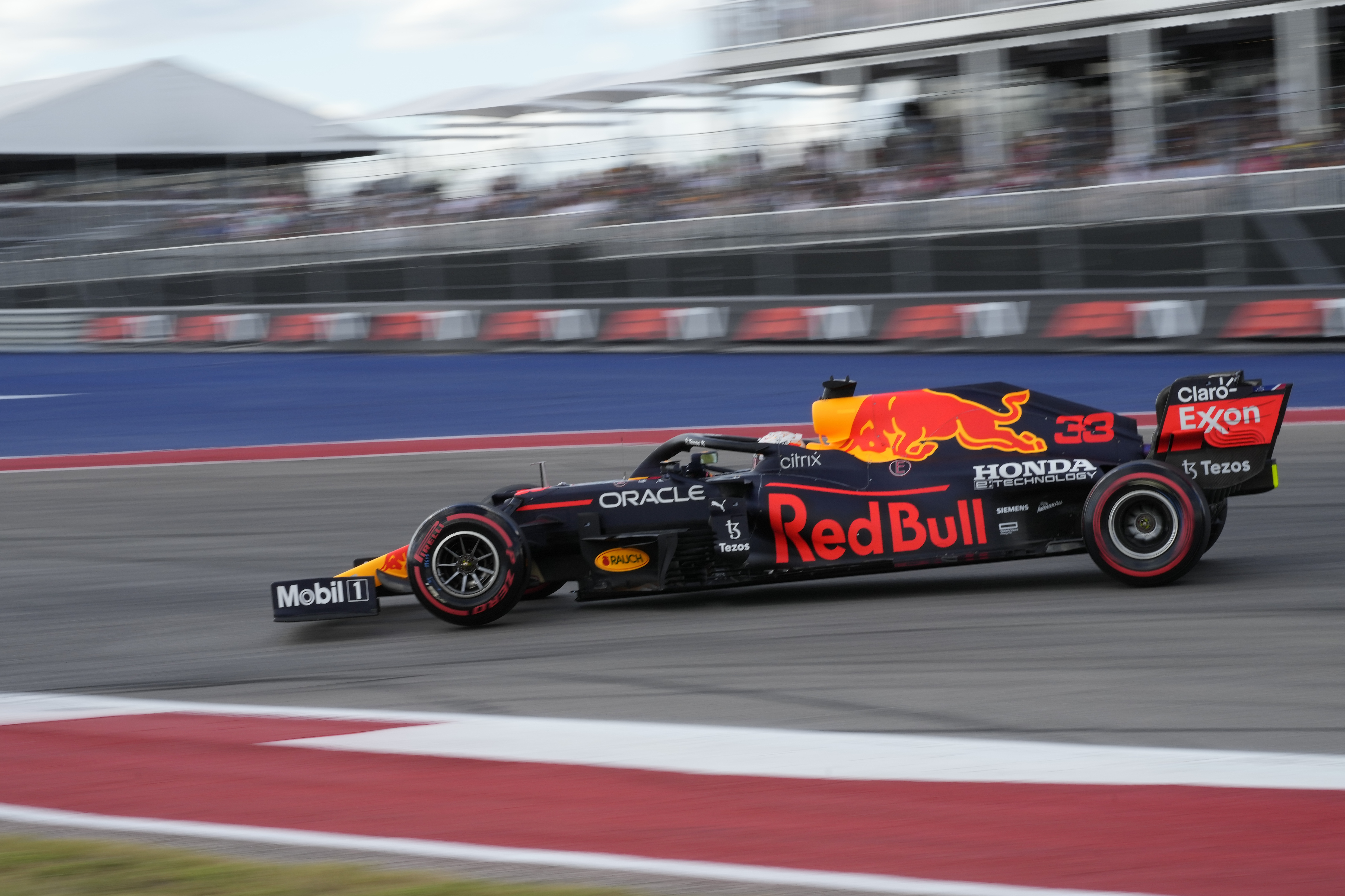 Red Bull driver Max Verstappen, of the Netherlands, drives into a turn during qualifications for the Formula One U.S. Grand Prix auto race at the Circuit of the Americas, Saturday, Oct. 23, 2021, in Austin, Texas. (AP Photo/Nick Didlick)