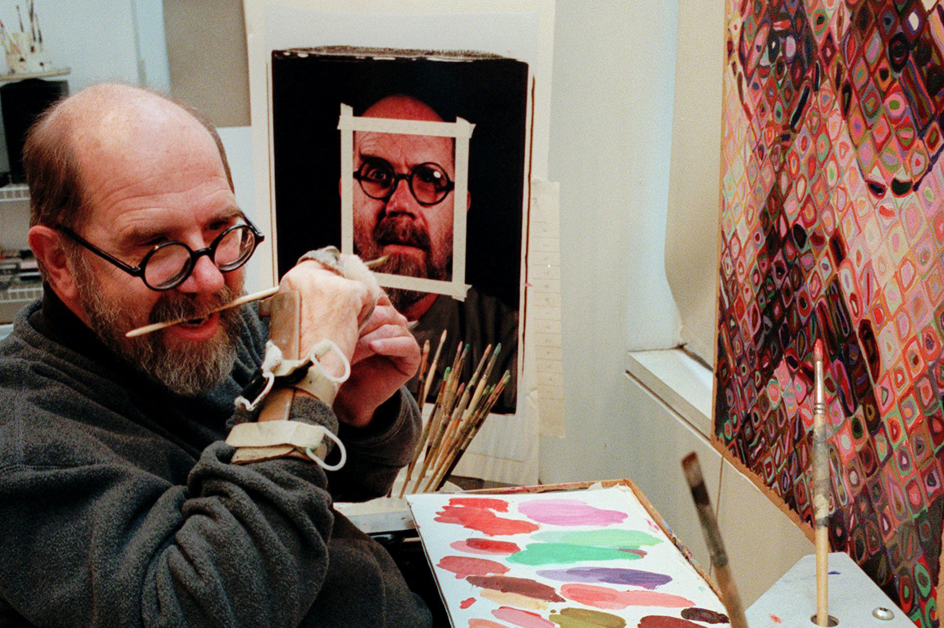 Chuck Close, CLOSE GRIPS BRUSH IN TEETH WITH HAND BRACE
