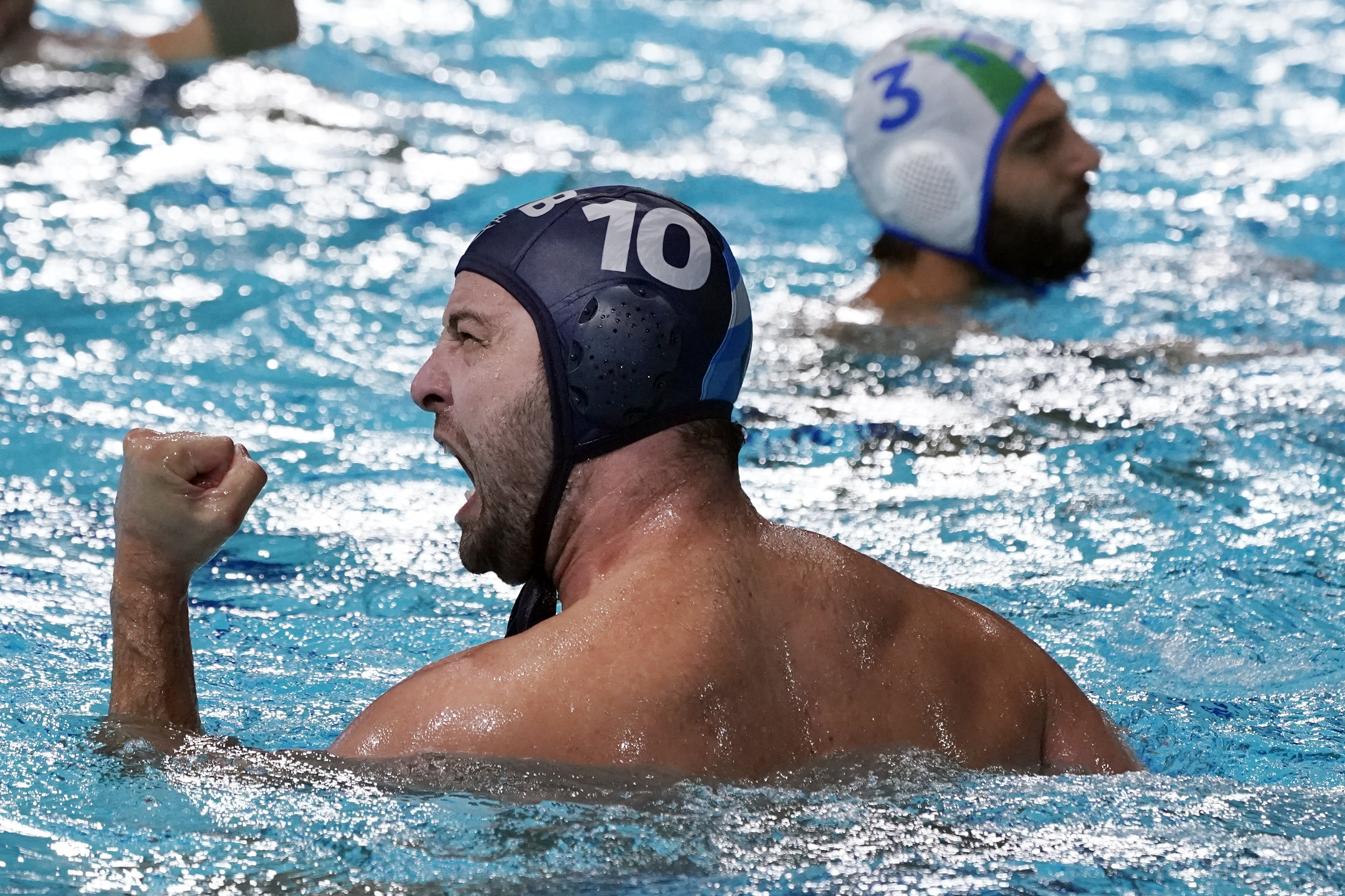 Serbia's Filip Filipovic (10) celebrates after scoring a goal against Italy during a quarterfinal round men's water polo match at the 2020 Summer Olympics, Wednesday, Aug. 4, 2021, in Tokyo, Japan. (AP Photo/Mark Humphrey)