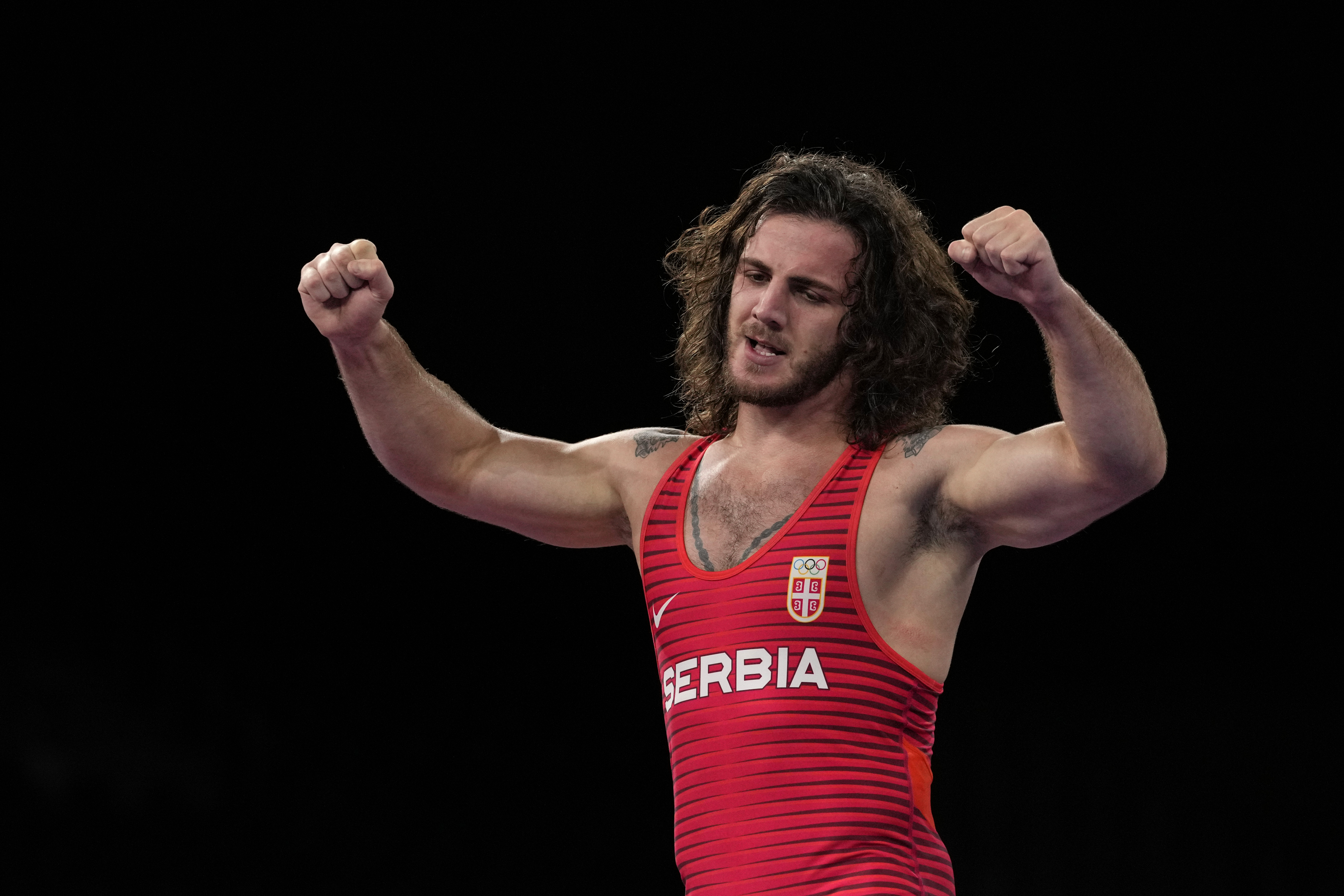 Serbia's Zurabi Datunashvili celebrates defeating Croatia's Ivan Huklek during the men's 87kg Greco-Roman wrestling bronze medal match at the 2020 Summer Olympics, Wednesday, Aug. 4, 2021, in Chiba, Japan. (AP Photo/Aaron Favila)