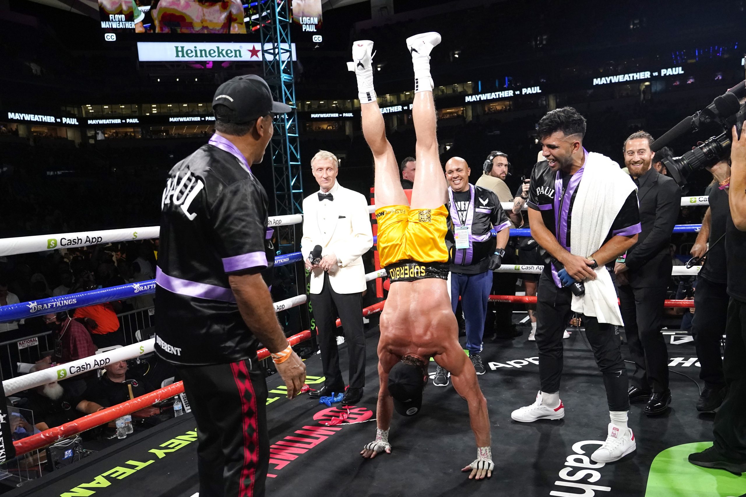Logan Paul does a hand stand after an exhibition boxing match against Floyd Mayweather at Hard Rock Stadium, Sunday, June 6, 2021, in Miami Gardens, Fla. (AP Photo/Lynne Sladky)