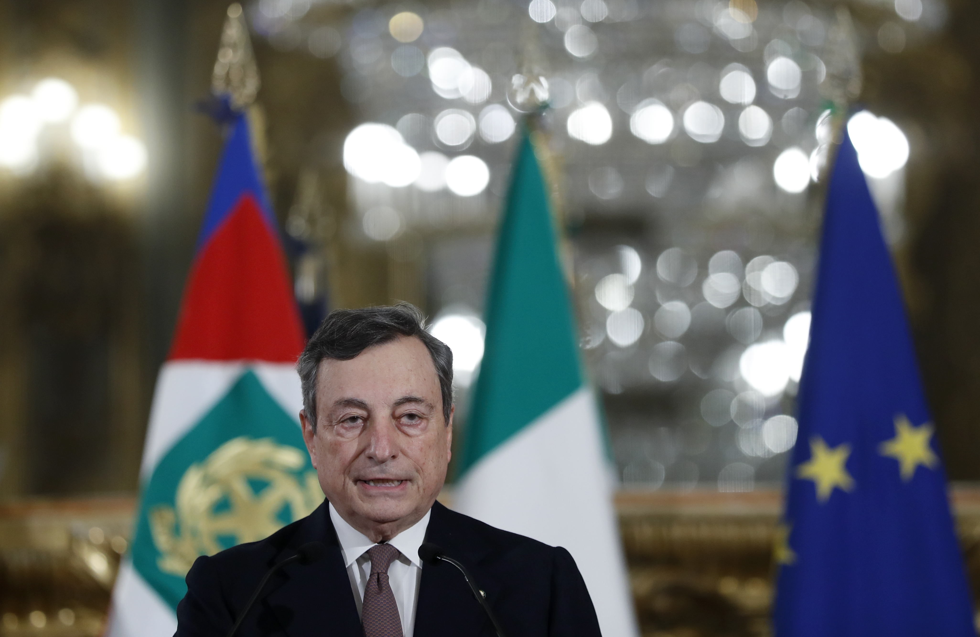 Incoming Italian Prime Minister Mario Draghi speaks to the media after meeting with Italian President Sergio Mattarella, in Rome, Italy, Friday, Feb. 12, 2021. (Yara Nardi/Pool photo via AP)