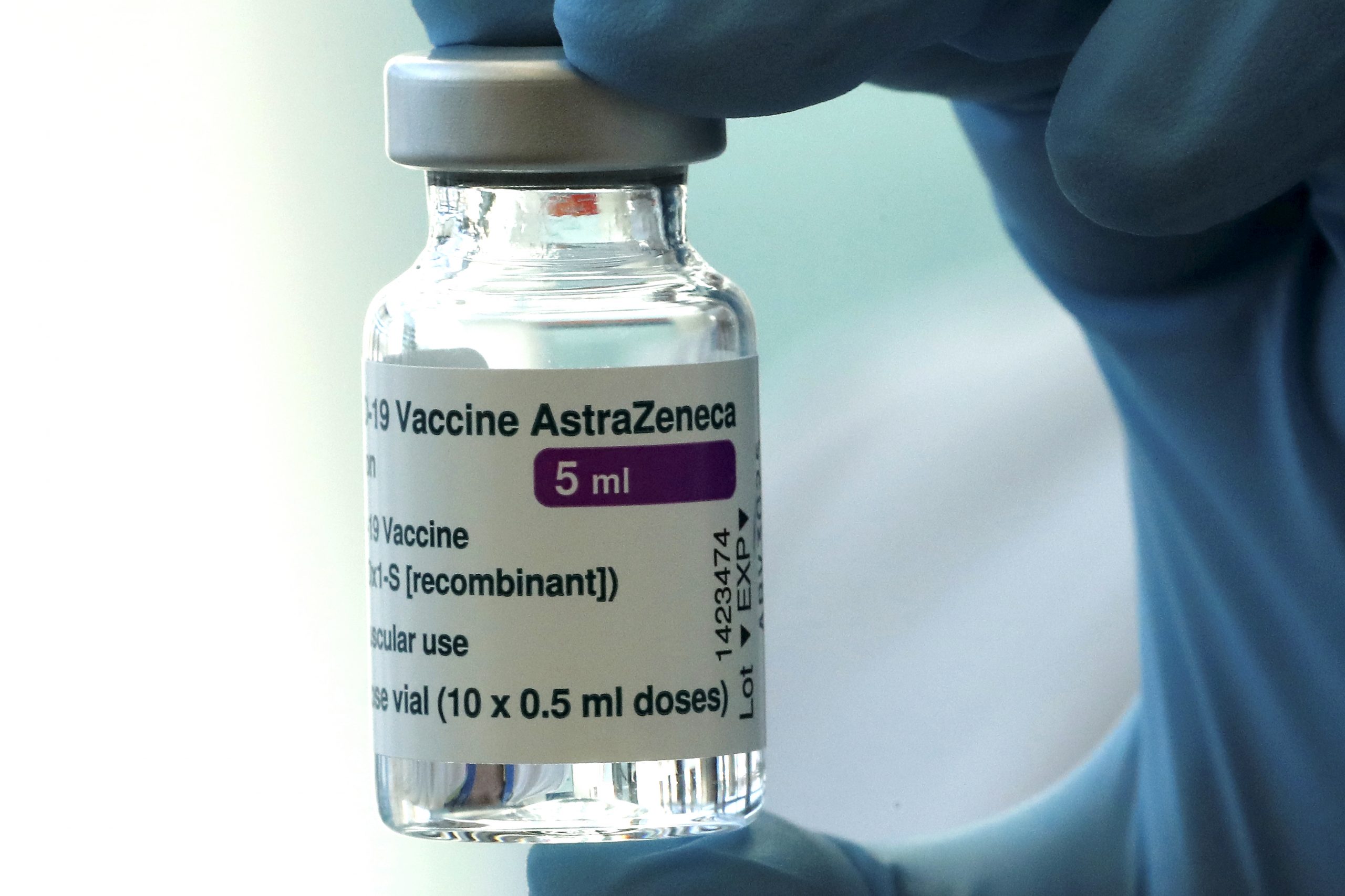 epa09004108 A health worker holds a vial of the Oxford-AstraZeneca COVID-19 vaccine to inoculate people during a vaccination campaign at the Pauls Stradins Clinical University Hospital in Riga, Latvia, 11 February 2021.  EPA-EFE/TOMS KALNINS