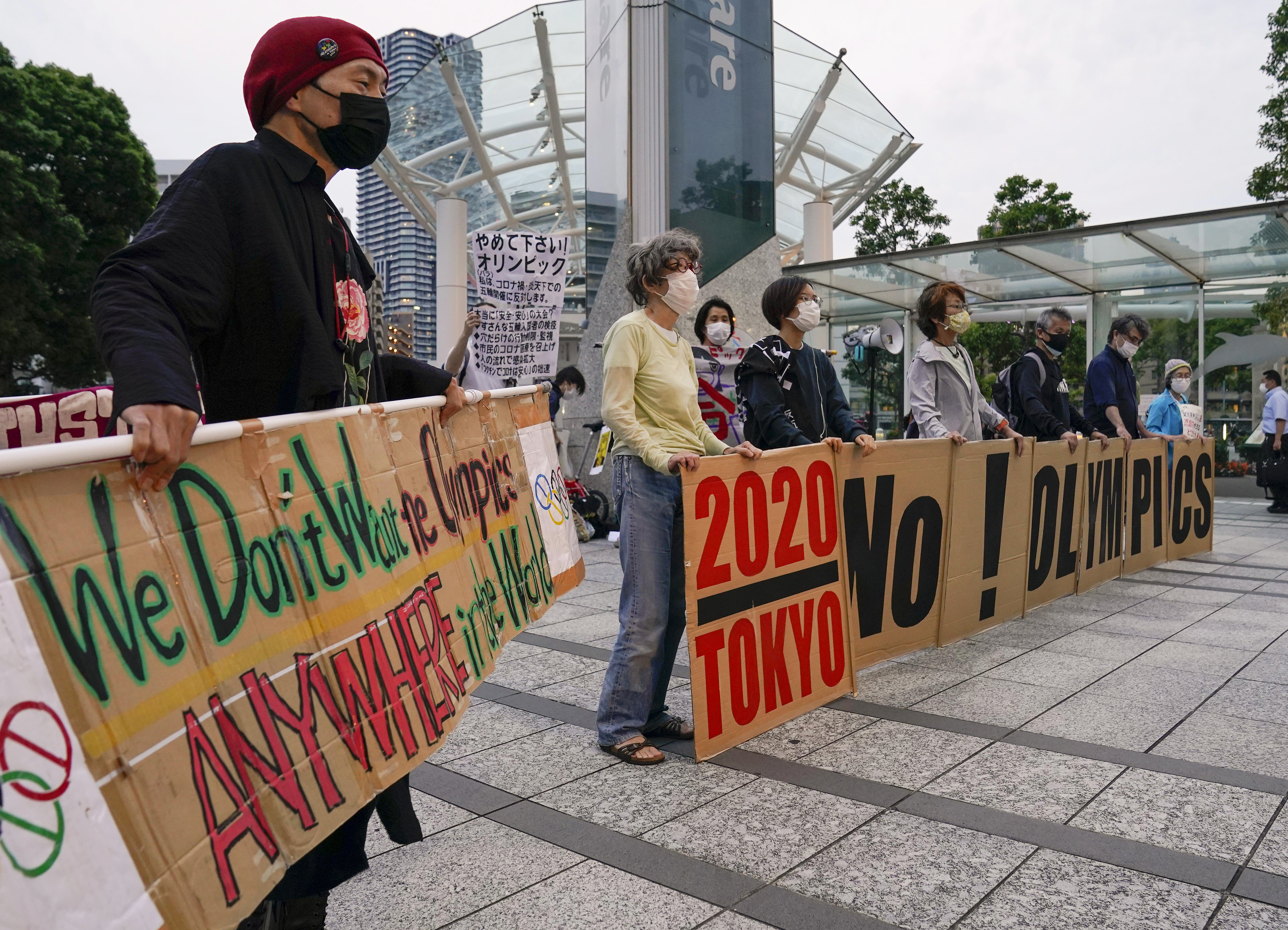 Demonstrators protest against hosting Tokyo 2020 Olympic Games