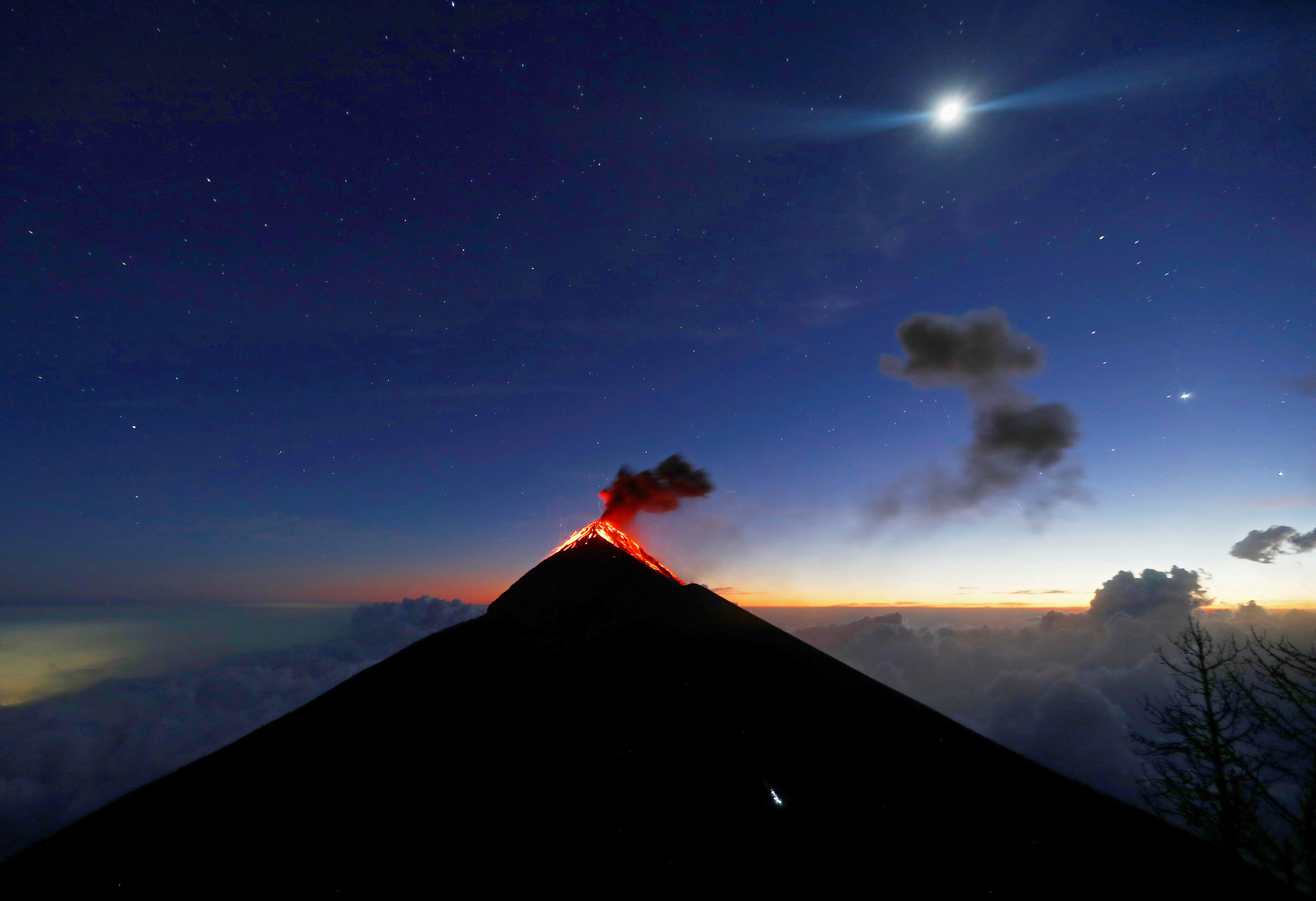 epa08045968 YEARENDER 2019 NOVEMBER
The Volcan de Fuego (Volcano of Fire), or Chi Q'aq, erupts as seen from a campsite on the Acatenango volcano, a popular tourist destination, in Acatenango, Guatemala, 30 November 2019.  EPA-EFE/Esteban Biba
