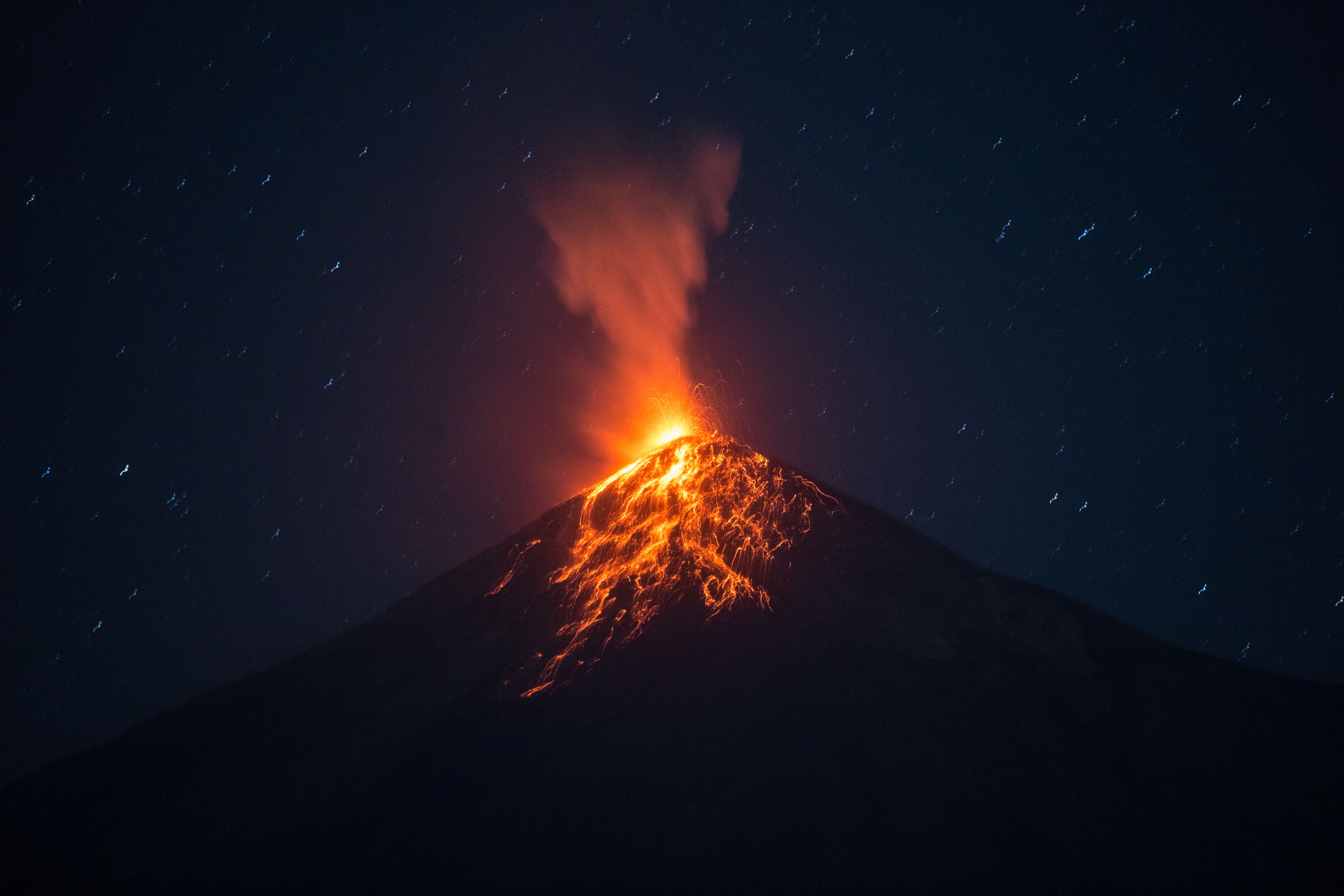 epa09013478 View of the eruption of Volcan de Fuego as seen from Alotenango, Guatemala, 14 February 2021. The volcano erupted on 14 February generating pyroclastic flows.  EPA-EFE/Esteban Biba
