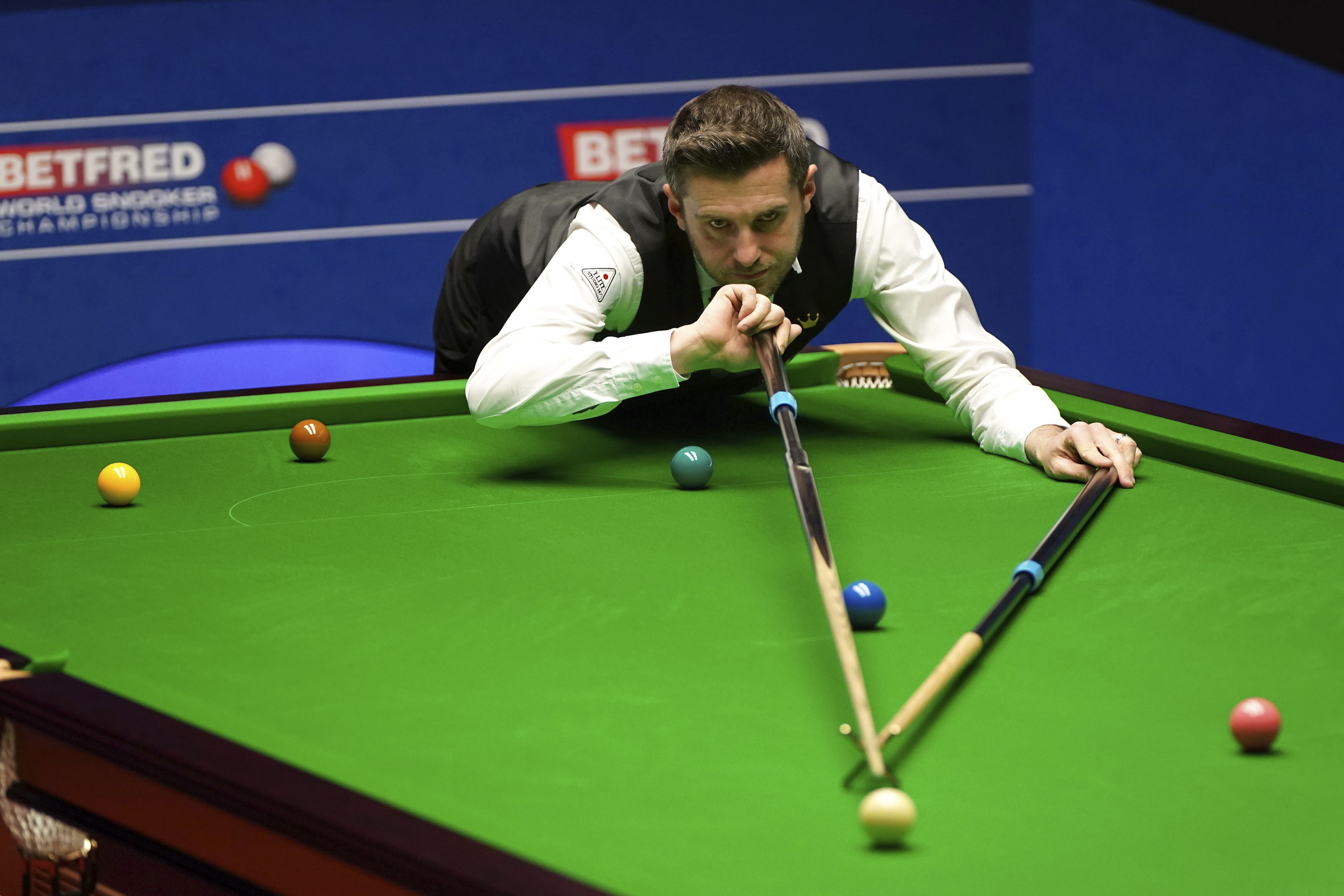 England's Mark Selby plays a shot on the way to winning the World Snooker Championships at the Crucible Theatre in Sheffield, England, Monday, May 3, 2021. (Zac Goodwin/PA via AP)