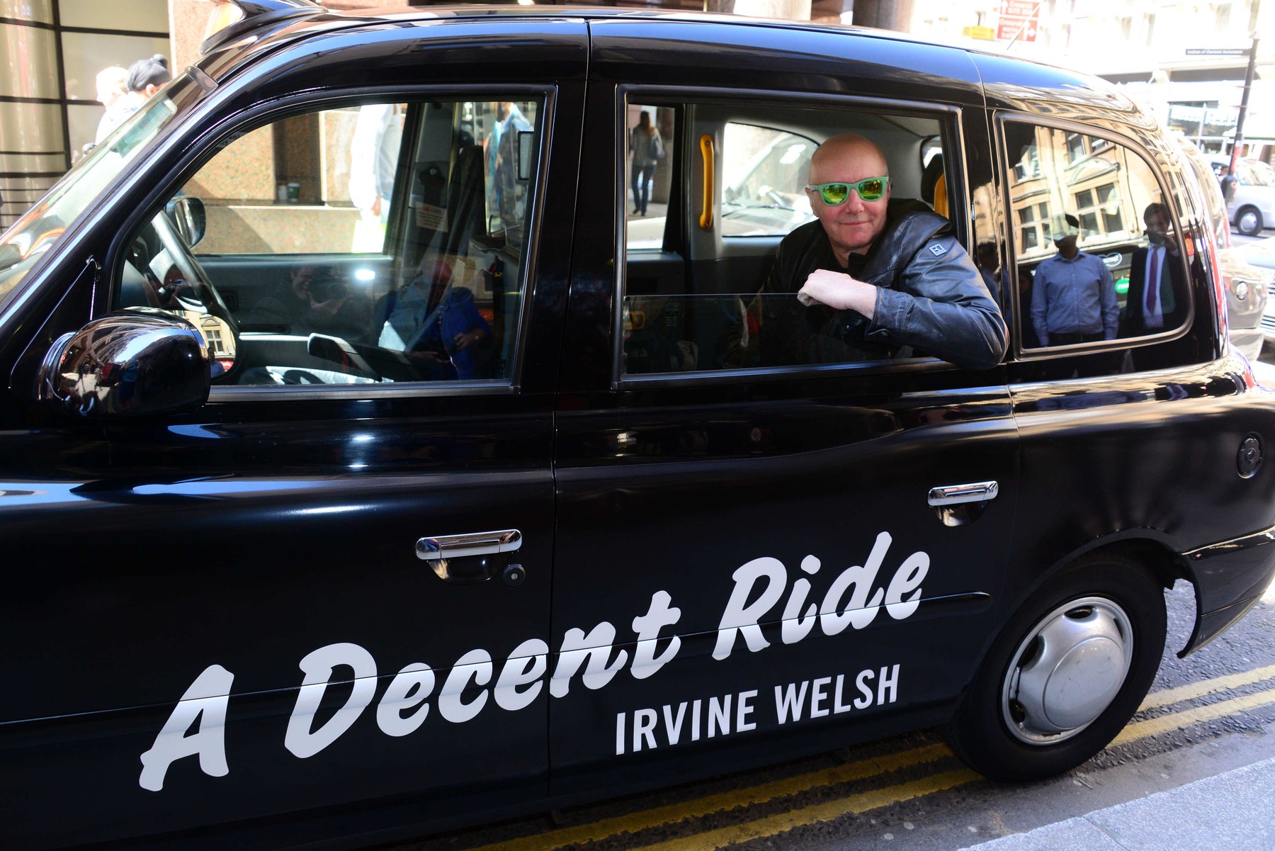 Irvine Welsh signs copies of his latest book 'A Decent Ride' in Waterstones, London