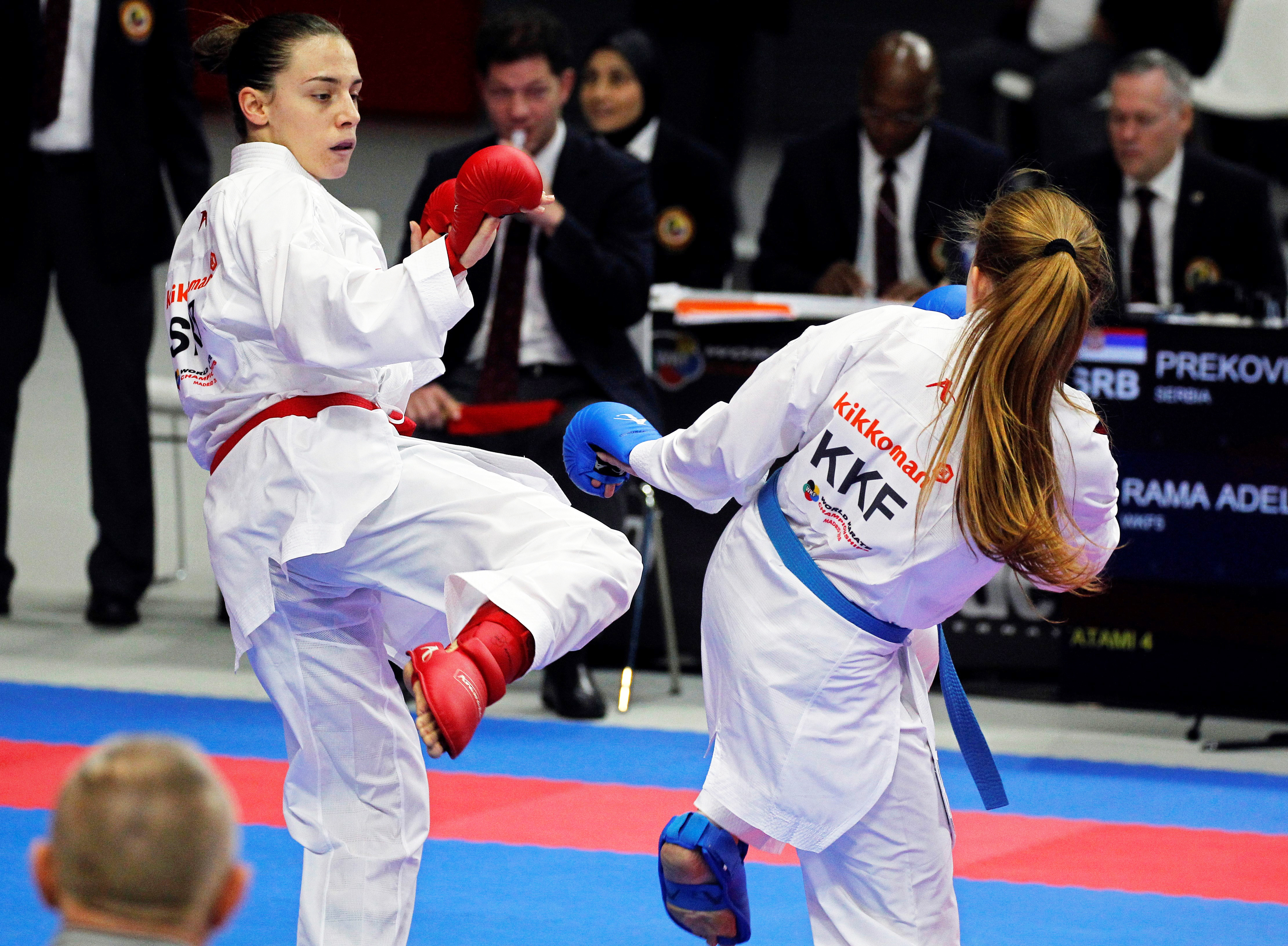 epa07148536 Jovana Prekovic (L) of Serbia in action against Adelina Rama (R) of Kosovo during their women's Kumite -61kg individual bout at the 24th Karate World Championships in Madrid, Spain, 07 November 2018.  EPA-EFE/VICTOR LERENA