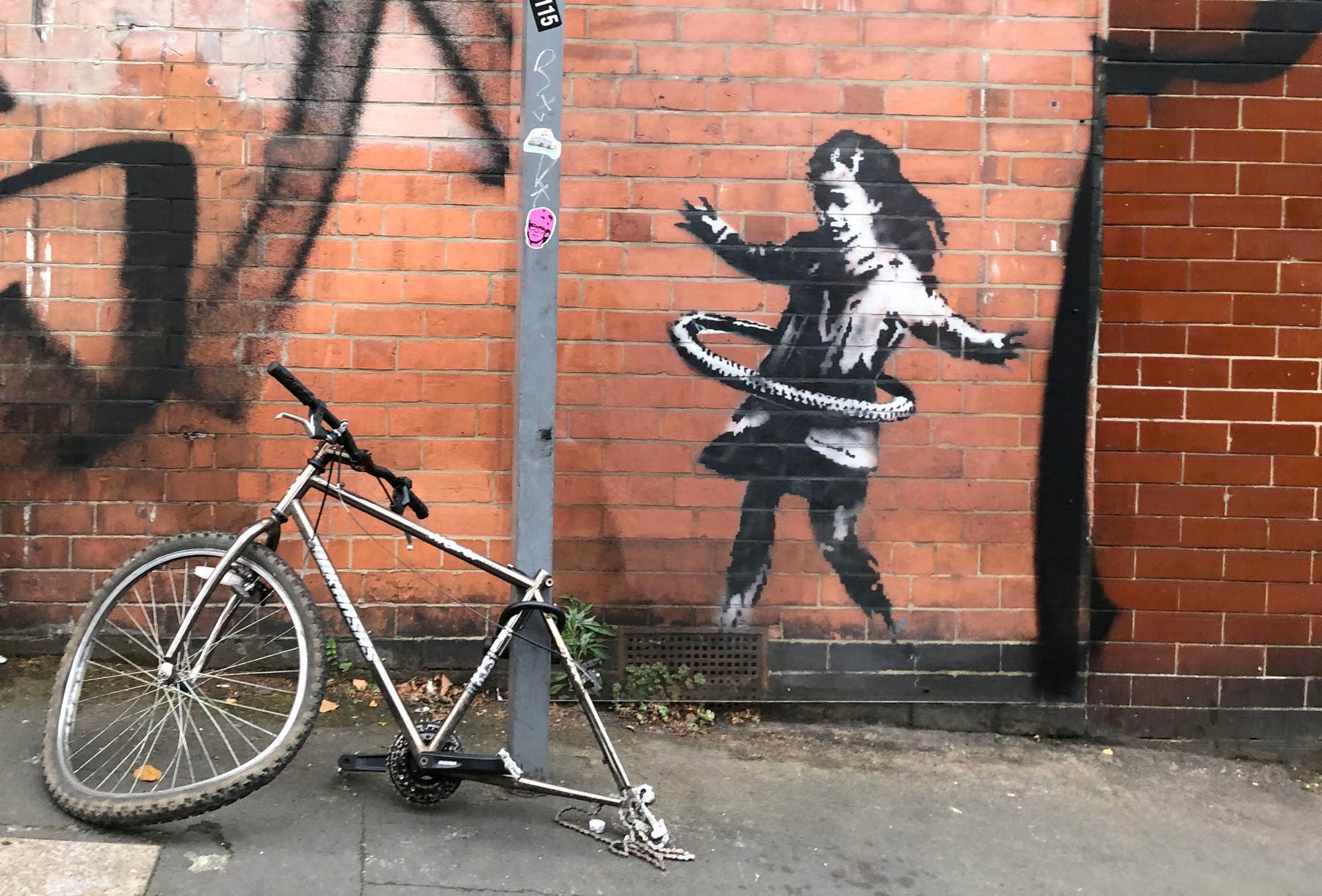 Banksy confirms hula-hoop girl mural in Nottingham is hisArtwork showing girl playing with a bicycle tyre appeared on street corner last week
