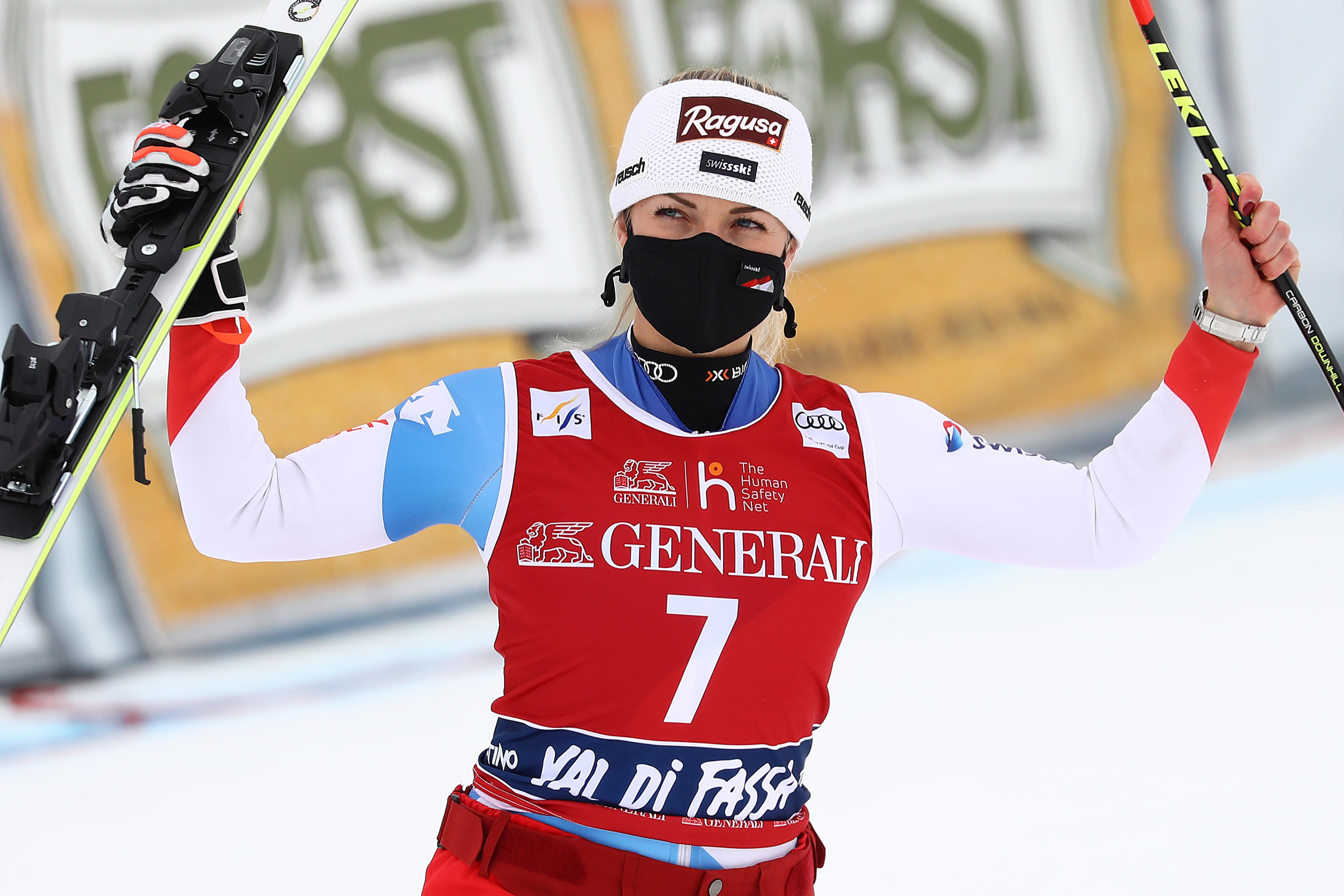 epa09039892 Winner Lara Gut-Behrami of Switzerland celebrates in the finish area after the Women's Downhill race at the FIS Alpine Skiing World Cup in Val di Fassa, Italy, 27 February 2021.  EPA-EFE/ANDREA SOLERO