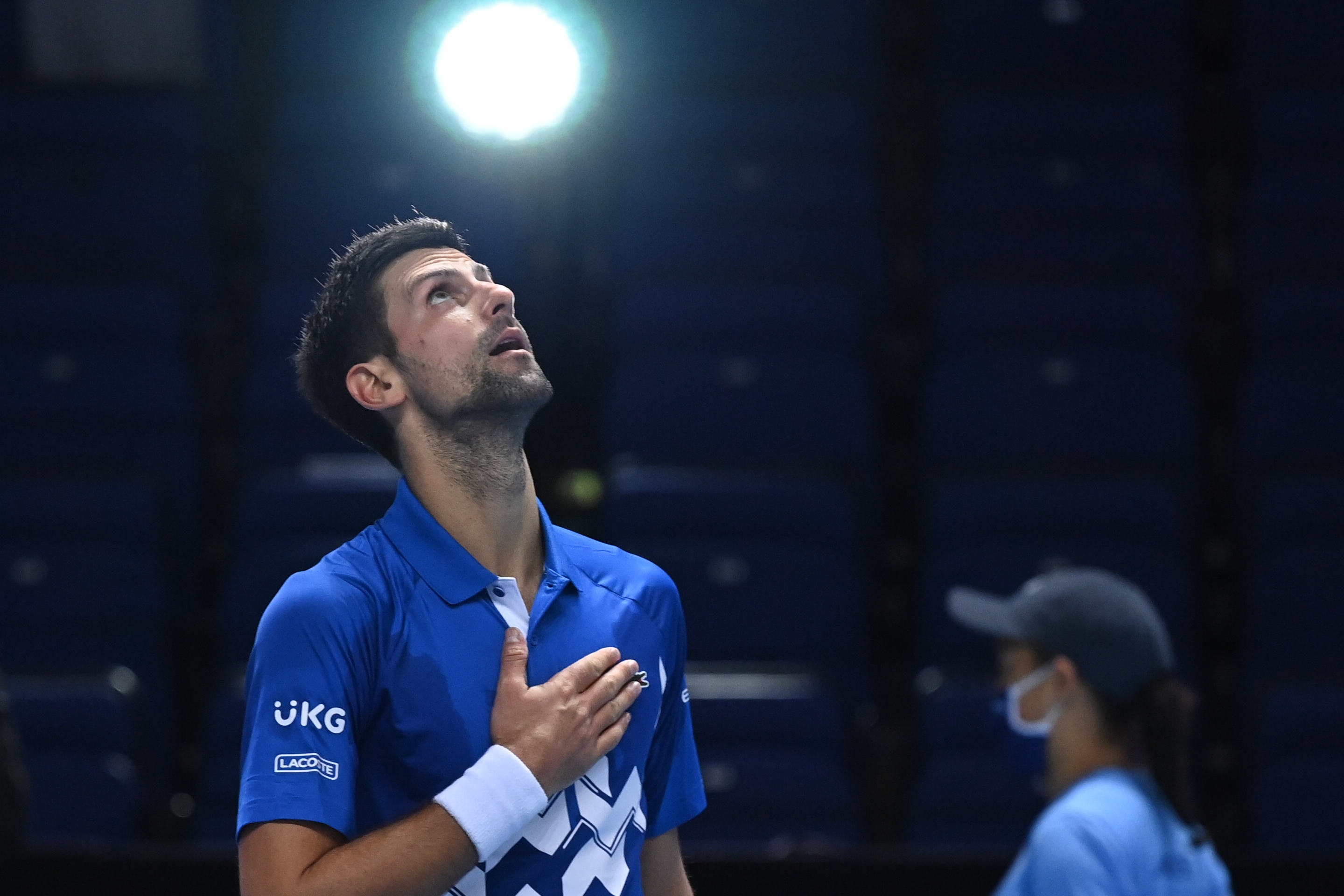 epa08823935 Novak Djokovic of Serbia celebrates after winning his group stage match against Diego Schwartzman of Argentina at the ATP Finals in London, Britain, 16 November 2020.  EPA-EFE/ANDY RAIN