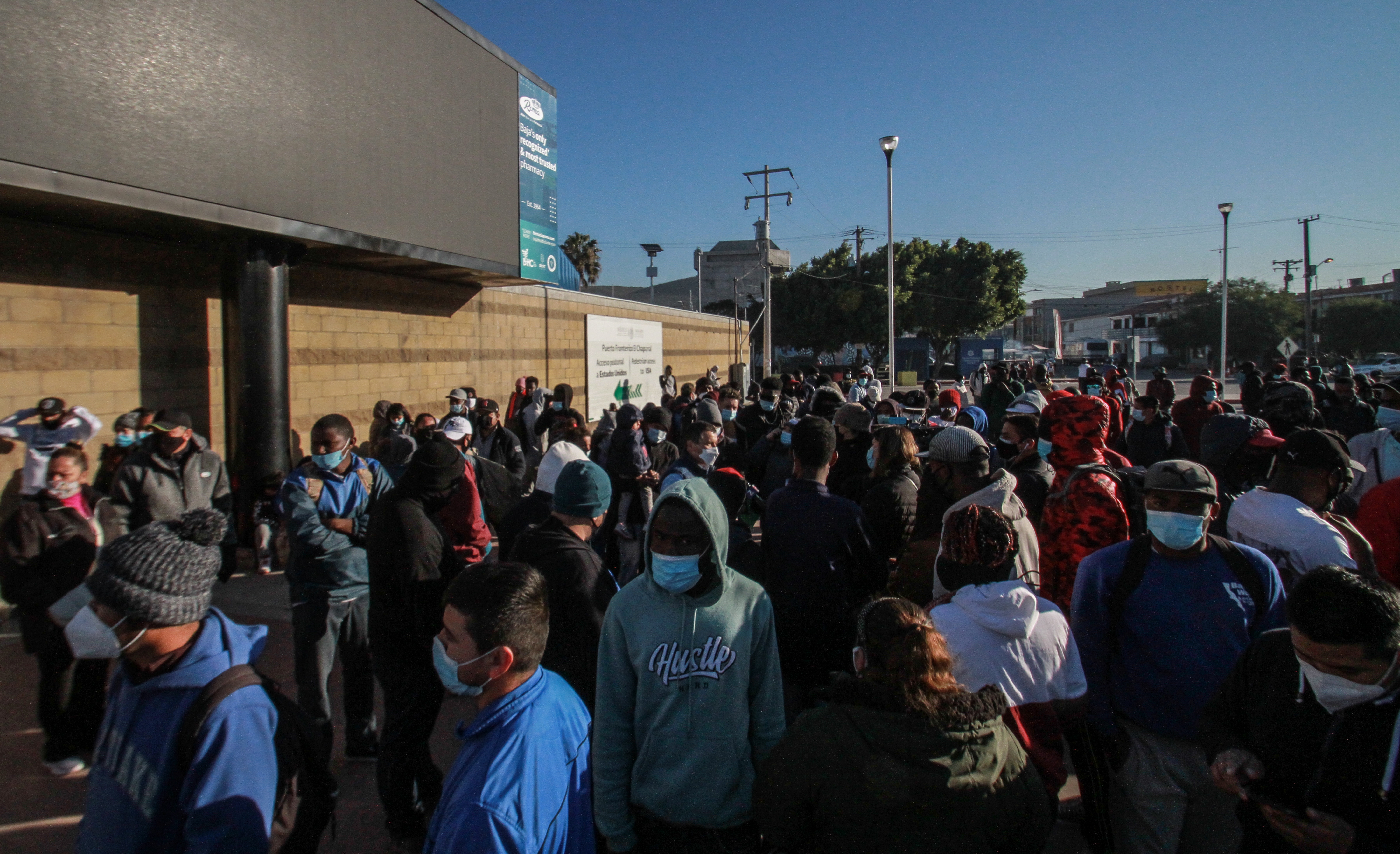 Migrants wait on the reopening of asylum cases by the US