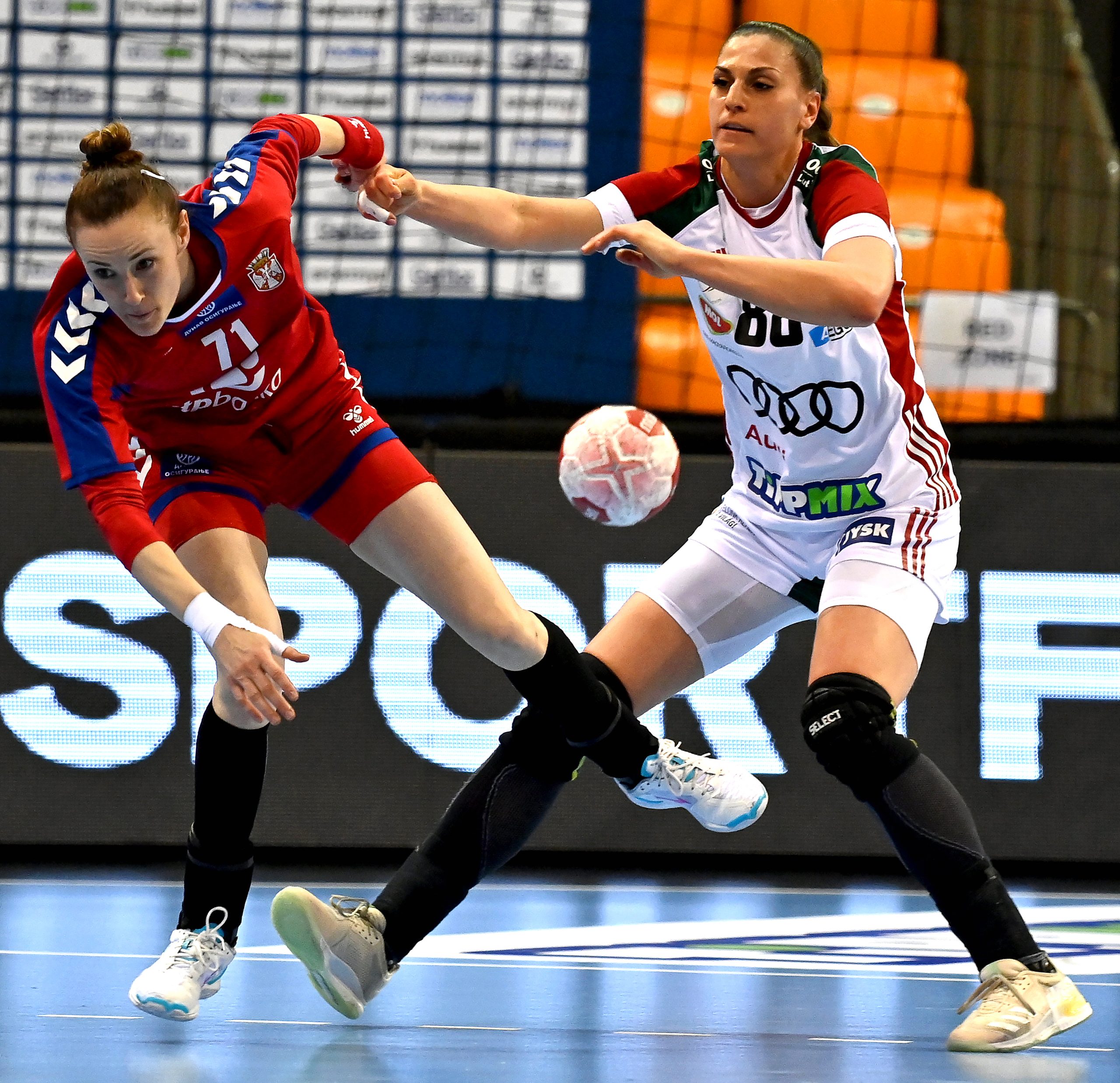 epa09086439 Nikoletta Kiss (R) of Hungary in action against Kristina Liscevic (L) of Serbia during the women's Olympic Games qualifying handball match between Hungary and Serbia in Gyor, Hungary, 20 March 2021.  EPA-EFE/Tibor Illyes HUNGARY OUT