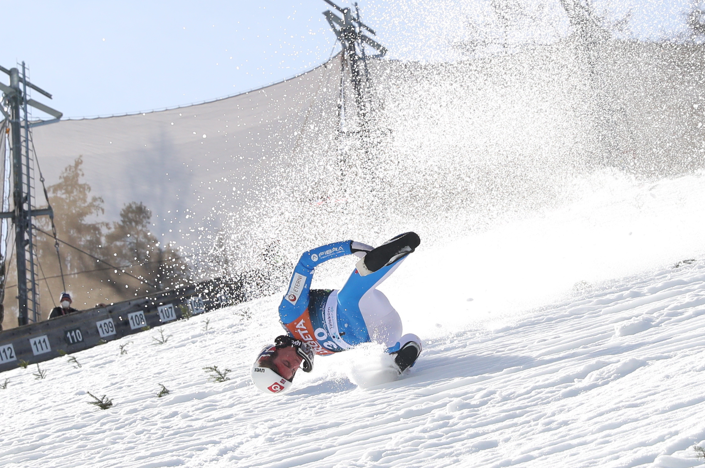 epa09096247 Daniel Andre Tande of Norway falls during a trial round of the Large Hill individual competition of the FIS Ski Jumping World Cup in Planica, Slovenia, 25 March 2021.  EPA-EFE/Grzegorz Momot POLAND OUT