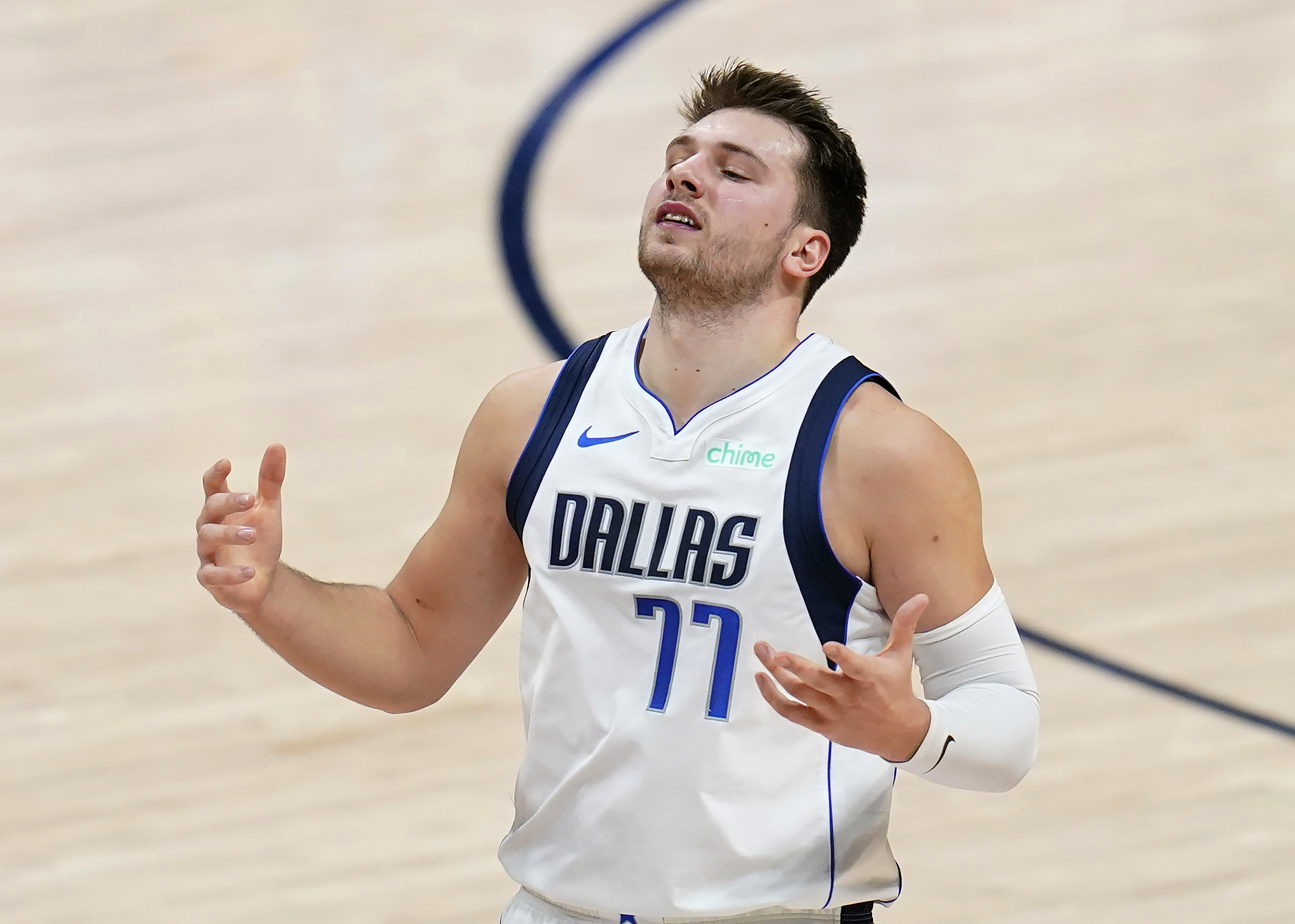 Dallas Mavericks guard Luka Doncic reacts to a missed shot against the Denver Nuggets during the second quarter of an NBA basketball game Thursday, Jan. 7, 2021, in Denver. (AP Photo/Jack Dempsey)