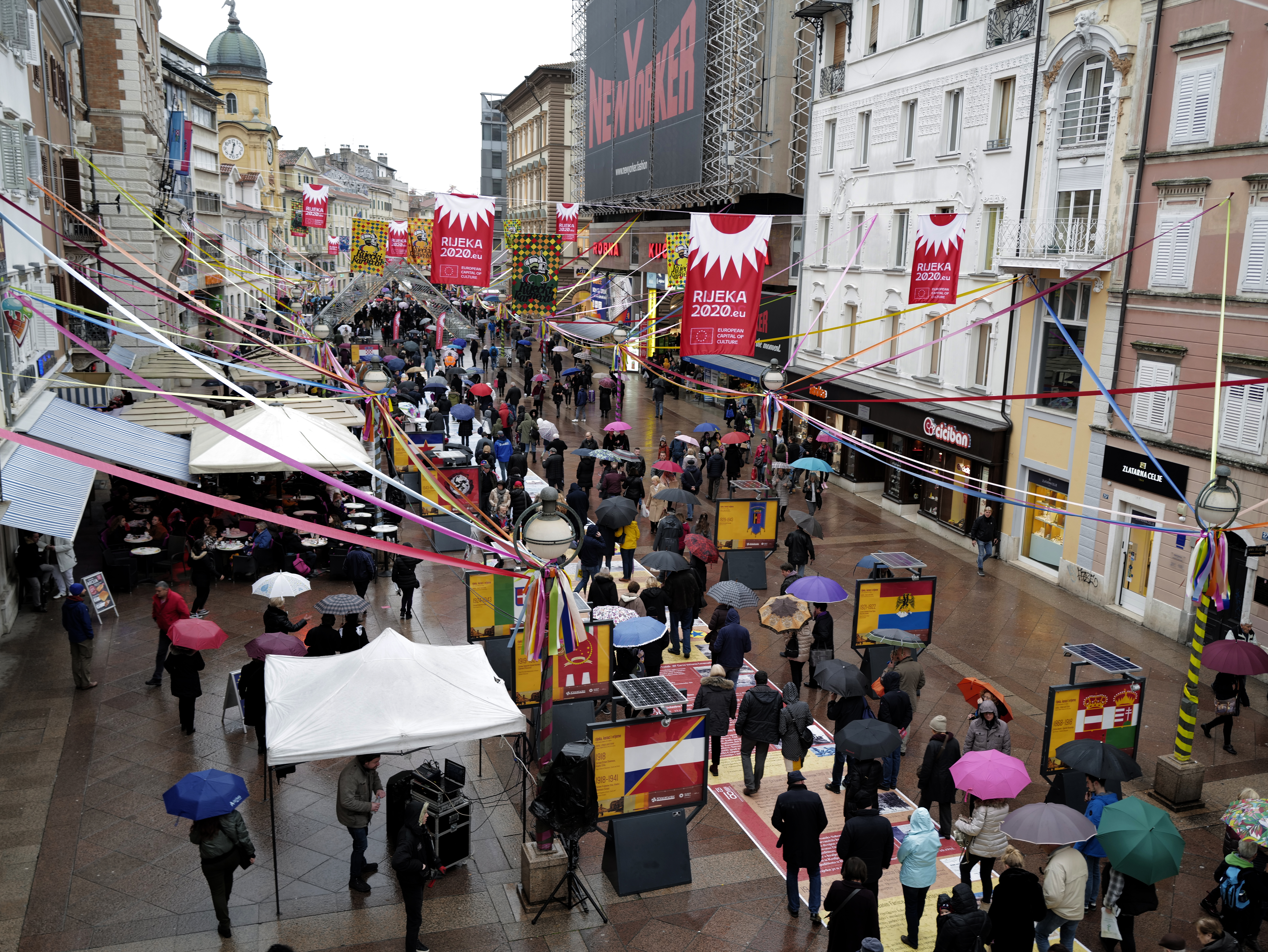 epa08185571 Citizens and tourists walk in the rain in Rijeka, Croatia, 01 February 2020. Rijeka will hold the title of the European Capital of Culture in 2020 and shares this year's designation with Galway, Ireland.  EPA-EFE/ANTONIO BAT