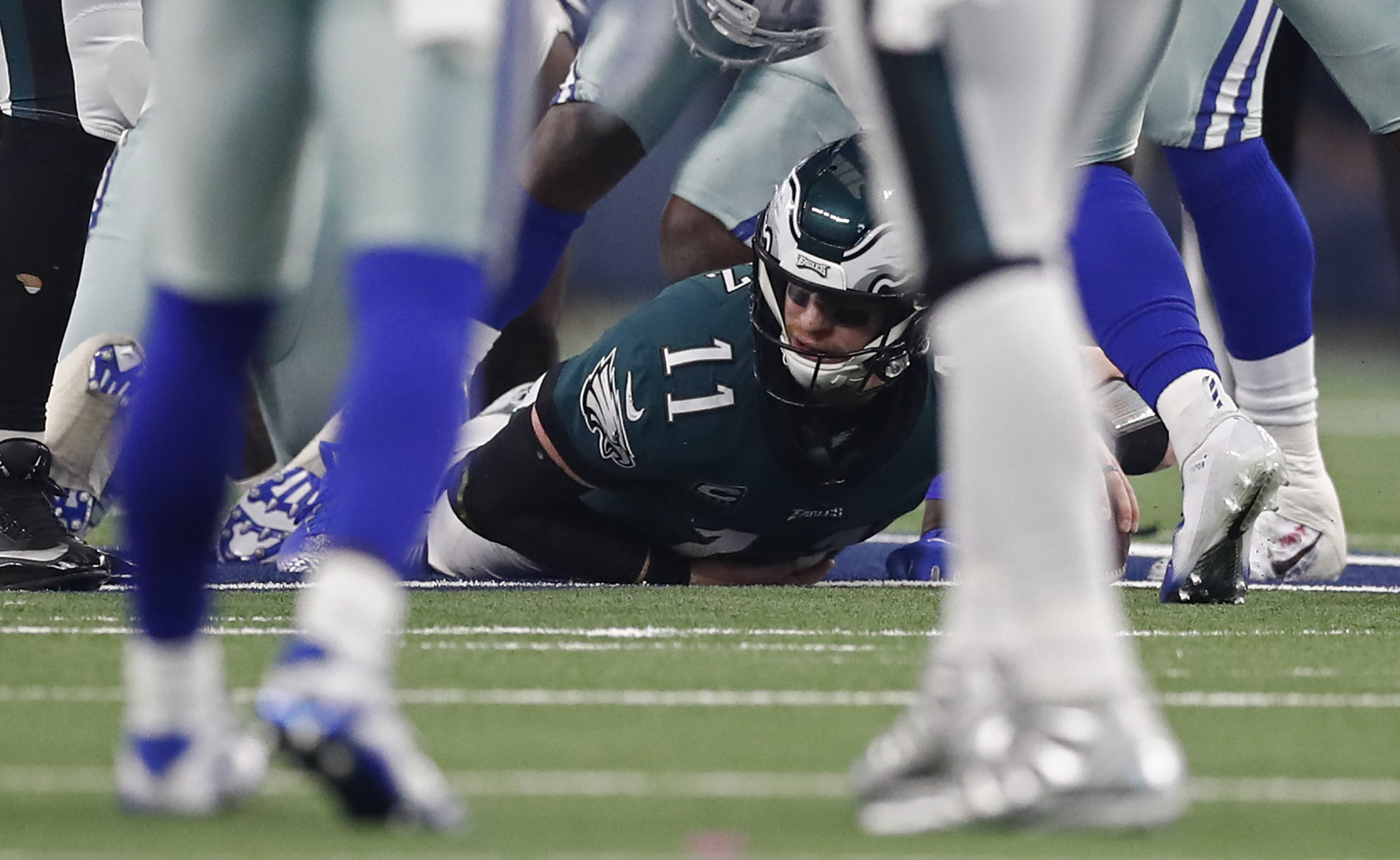 epa07220614 Philadelphia Eagles quarterback Carson Wentz is sacked by the Dallas Cowboys in the first half of their game at AT&amp;T Stadium in Arlington, Texas, USA, 09 December 2018.  EPA-EFE/LARRY W. SMITH