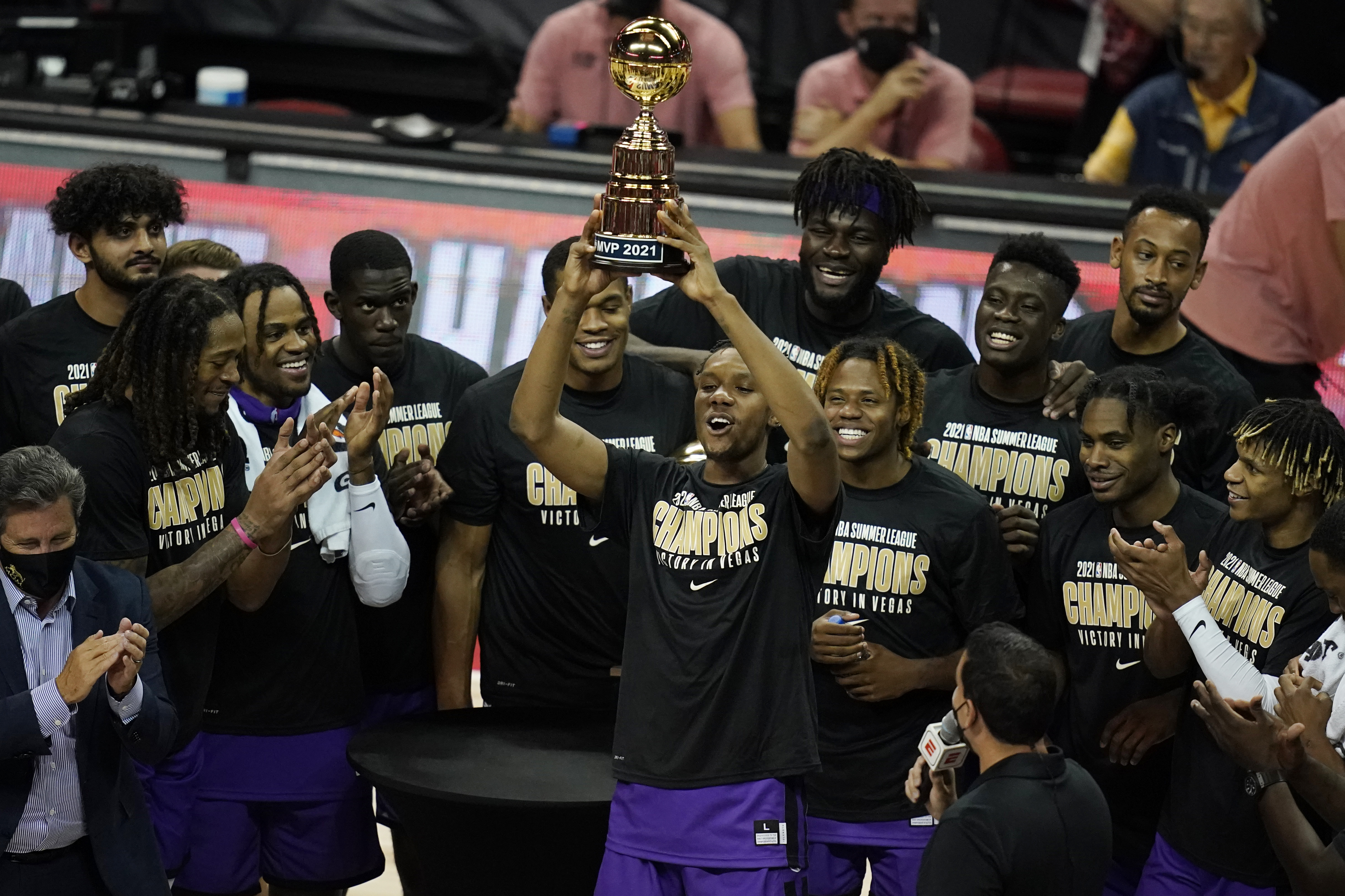 Sacramento Kings' Louis King holds up the MVP trophy after winning the award for the NBA summer league championship basketball game against the Boston Celtics, Tuesday, Aug. 17, 2021, in Las Vegas. (AP Photo/John Locher)