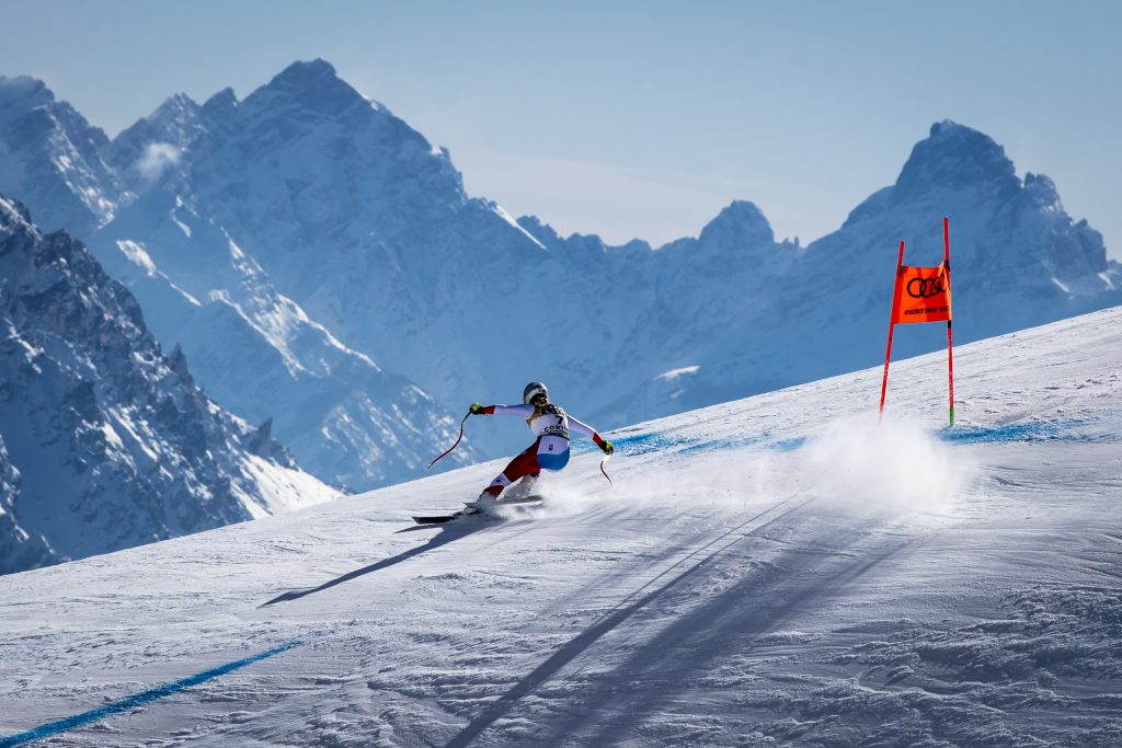 epa09008829 Corinne Suter of Switzerland is on her way to win the gold medal in the women's Downhill race at the FIS Alpine Skiing World Championships in Cortina d'Ampezzo, Italy, 13 February 2021.  EPA-EFE/JEAN-CHRISTOPHE BOTT