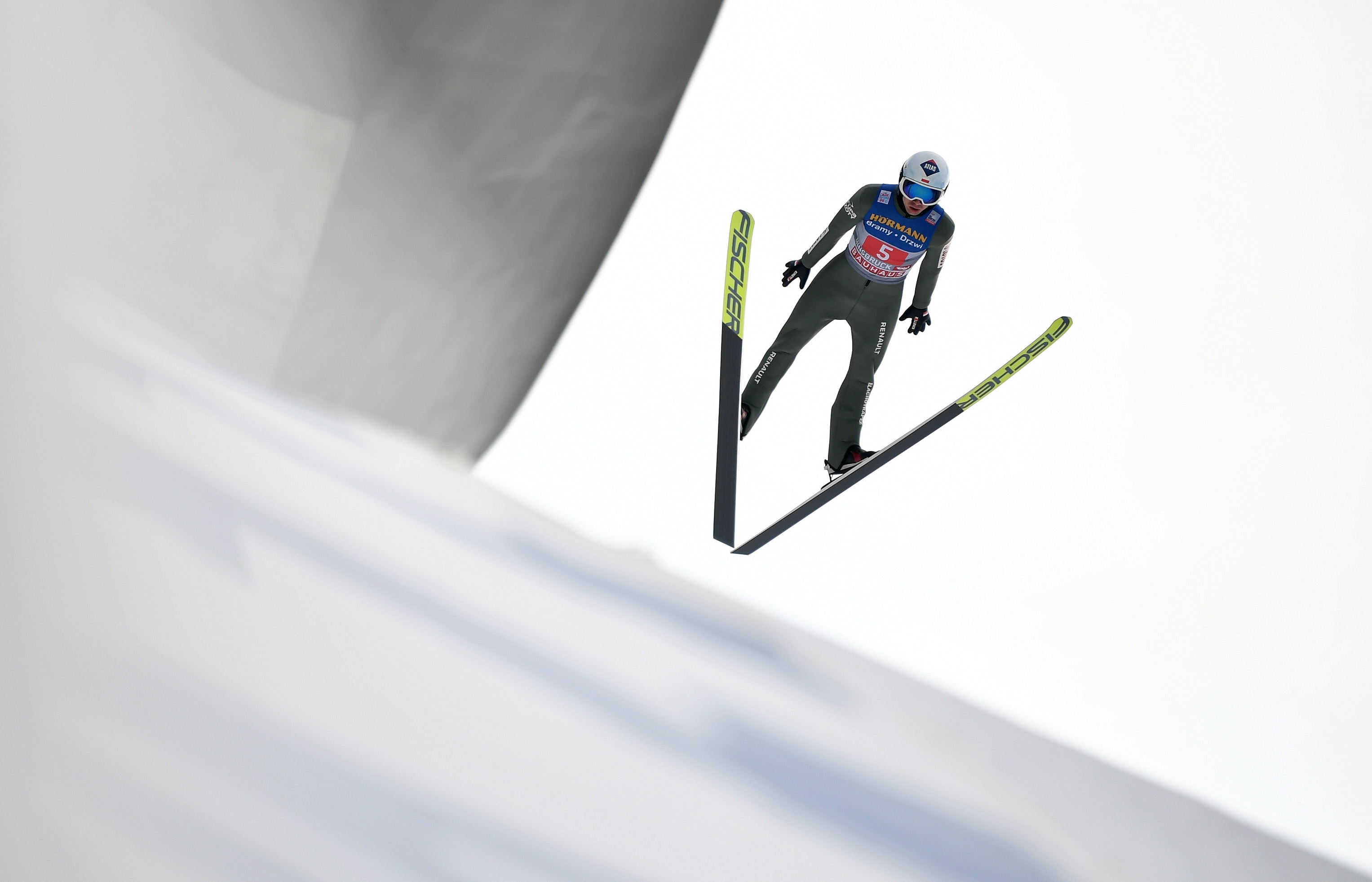epa08916589 Kamil Stoch of Poland is airborne during the third stage of the 69th Four Hills Tournament in Innsbruck, Austria, 03 January 2021.  EPA-EFE/PHILIPP GUELLAND