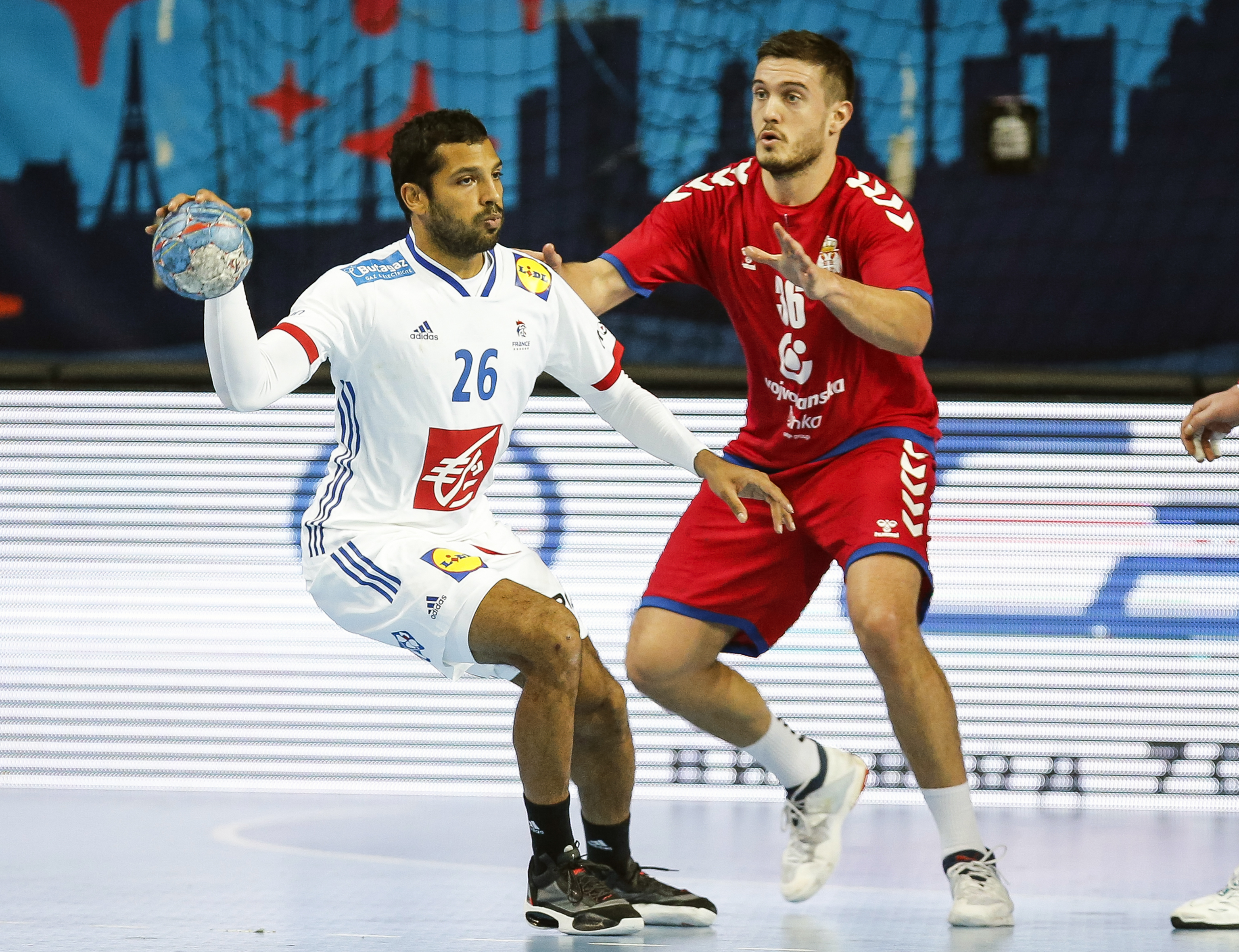 BELGRADE, SERBIA - JANUARY 05: Nicolas Claire (L) of France in action against Milos Orbovic (R) of Serbia during the 2022 European Handball Championship Qualifier on January 5, 2021 in Zrenjanin, Serbia. (Photo by Srdjan Stevanovic/Getty Images)