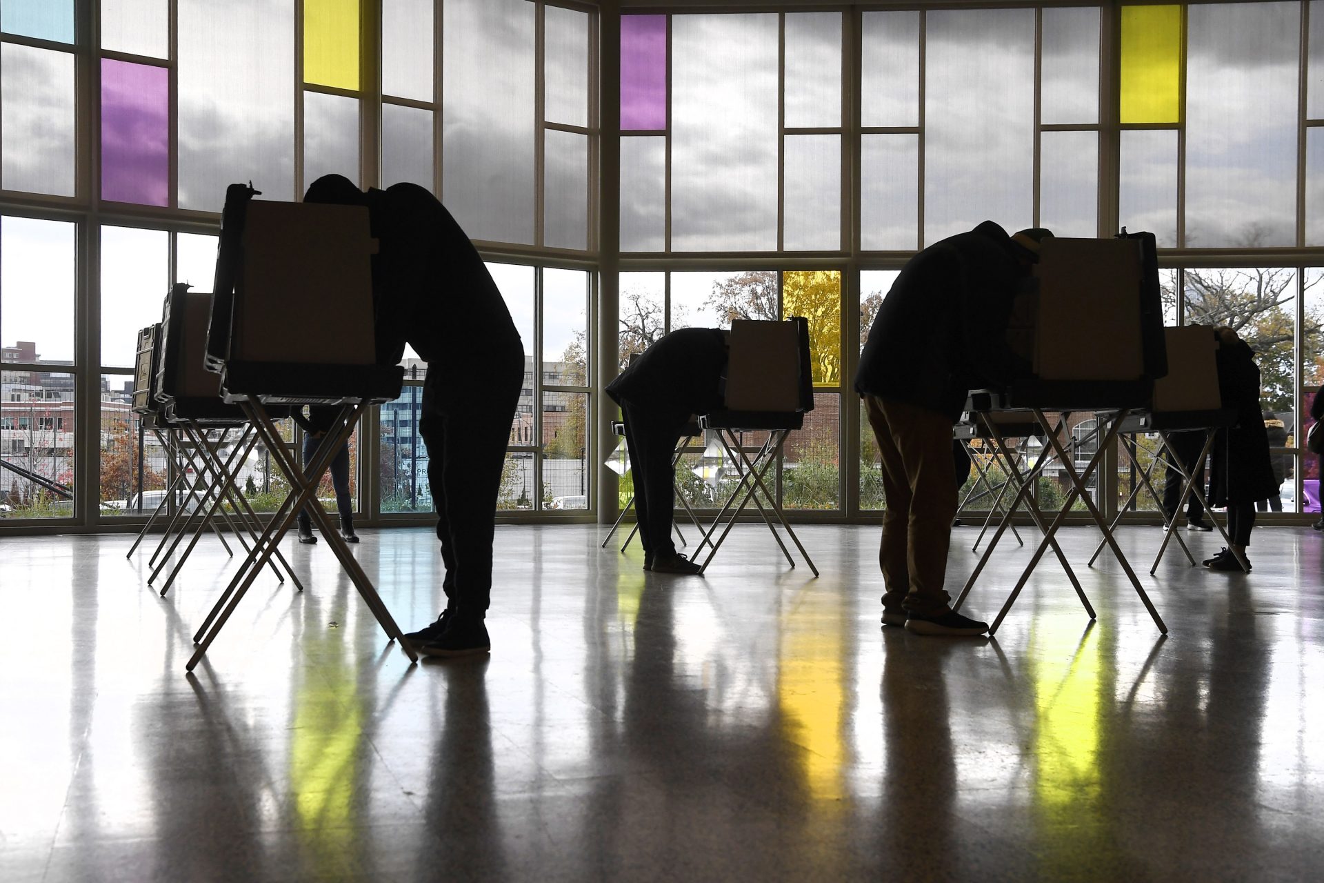 Voters mark their ballots at First Presbyterian Church on Election Day, Tuesday, Nov. 3, 2020, in Stamford, Conn. (AP Photo/Jessica Hill)