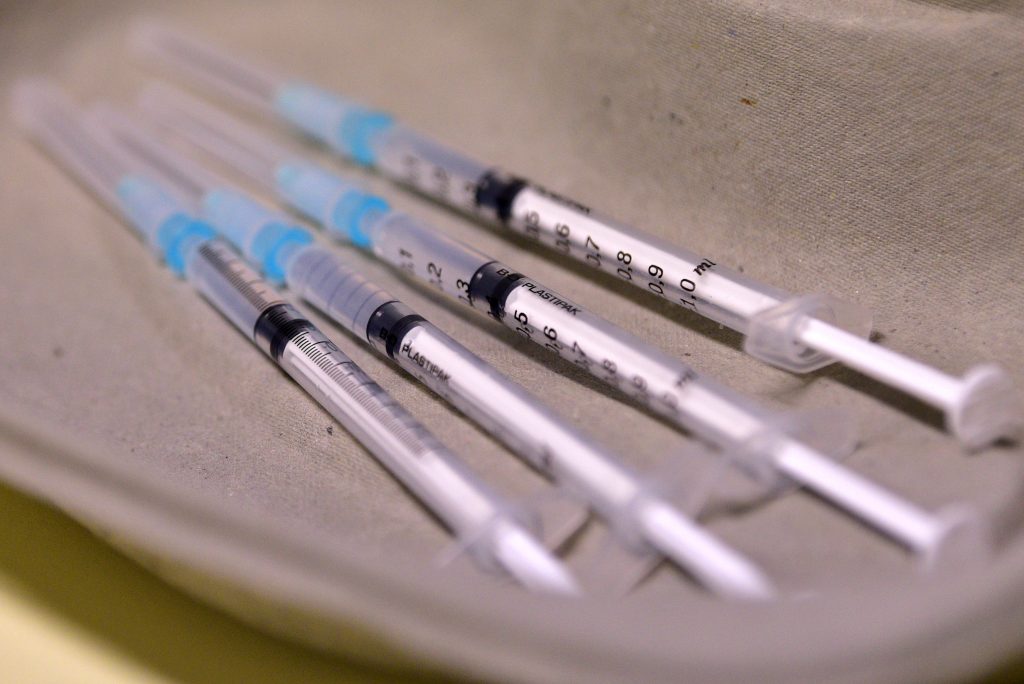 epa08905664 Syringes for injection of the Pfizer-BioNTech vaccine against COVID-19 are on display during vaccination at the Home for Elderly people Fuzine, in Ljubljana, Slovenia, 27 December 2020.  EPA-EFE/IGOR KUPLJENIK